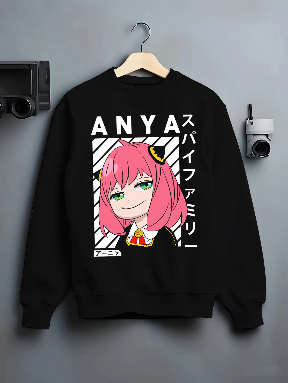 Black crewneck sweatshirt on hanger showing Anya Forger from Spy x Family: Spy x Family pink-haired portrait