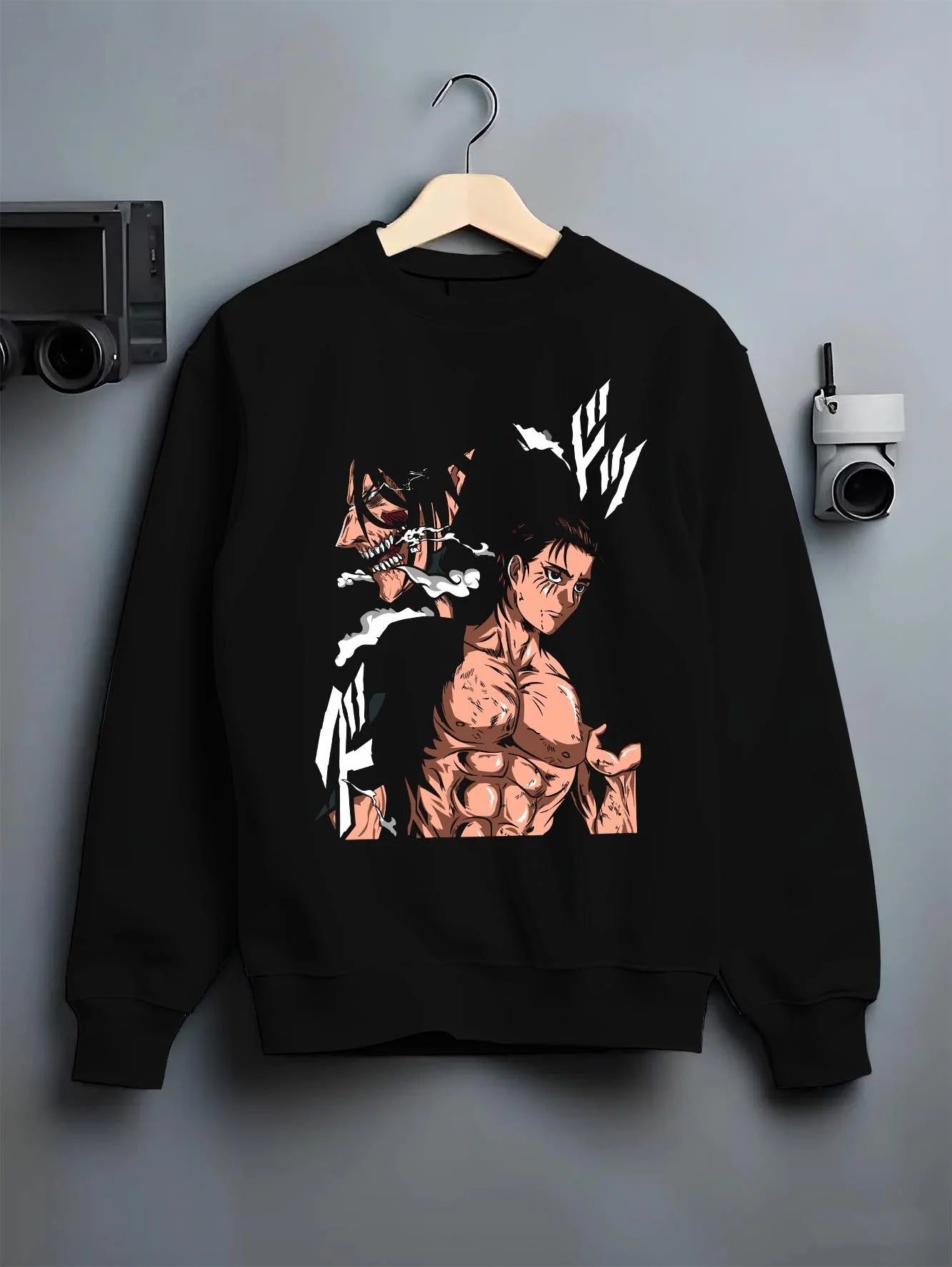 Black crewneck sweatshirt on hanger with Eren Yeager Hoodie Attack on Titan Shifter Titan Power graphic premium wear.