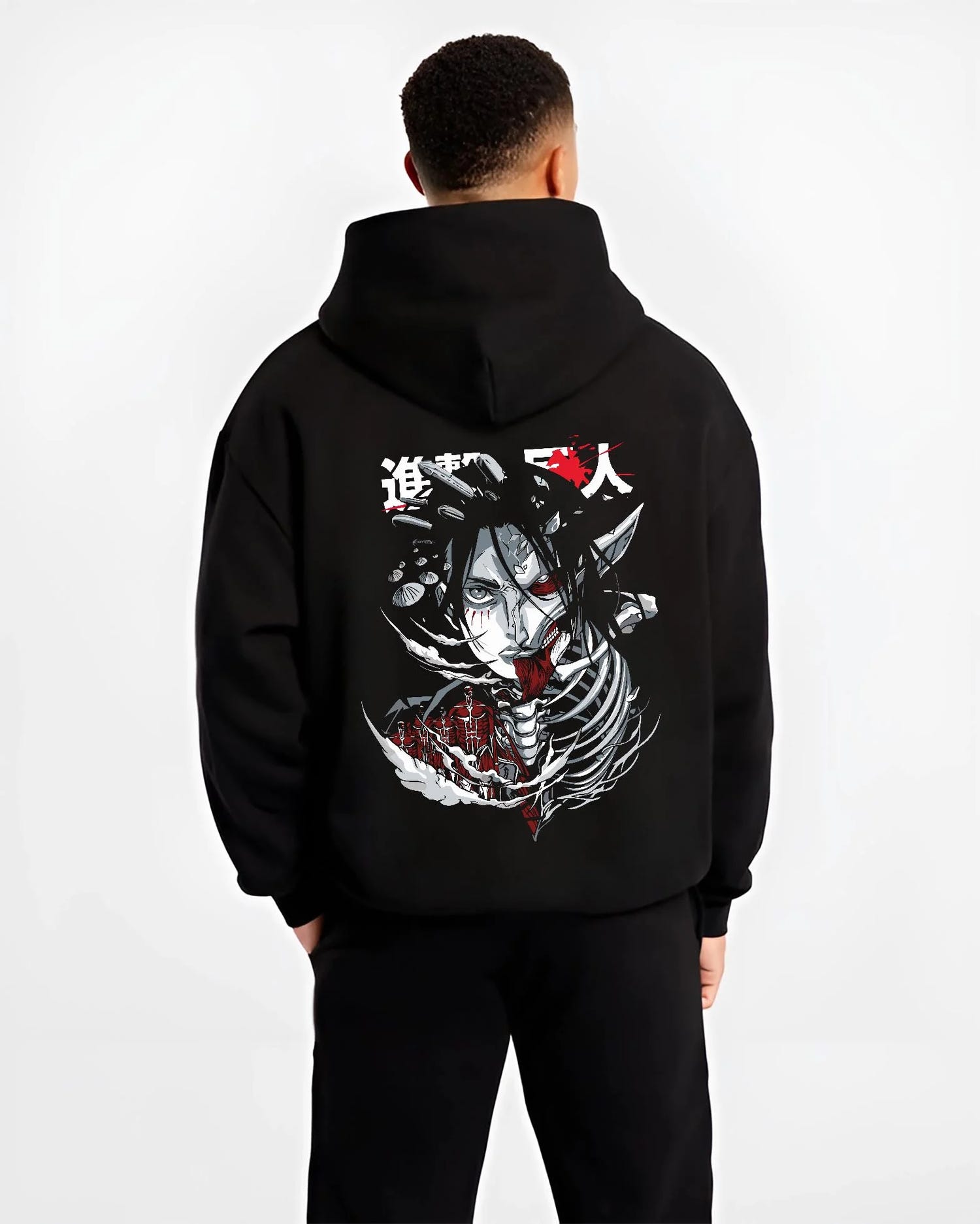 Black hoodie worn by male model, back view with Founding Titan Hoodie Attack on Titan Skull Face Panel graphic bold anime graphic.