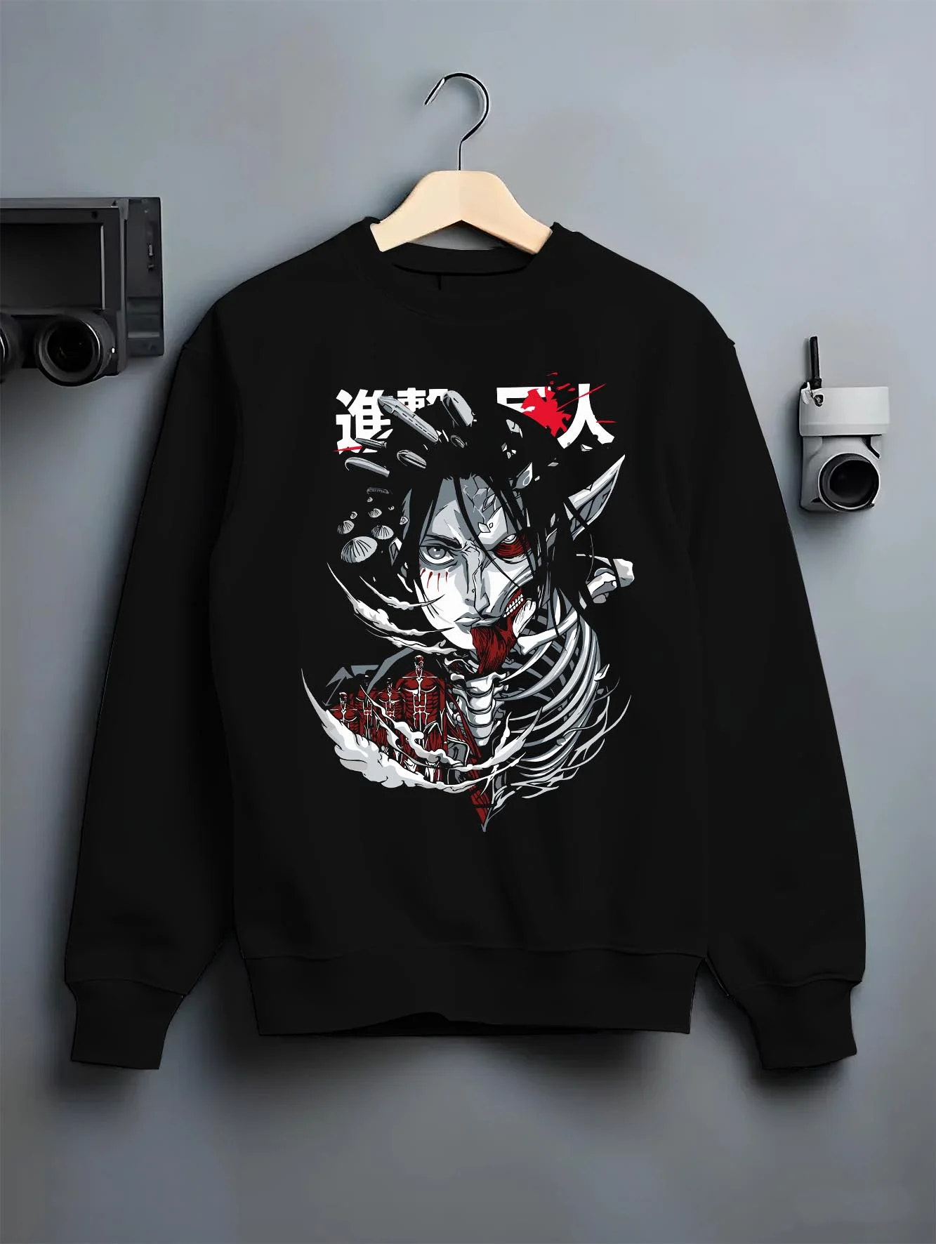 Black crewneck sweatshirt on hanger with Founding Titan Hoodie Attack on Titan Skull Face Panel graphic bold anime graphic.