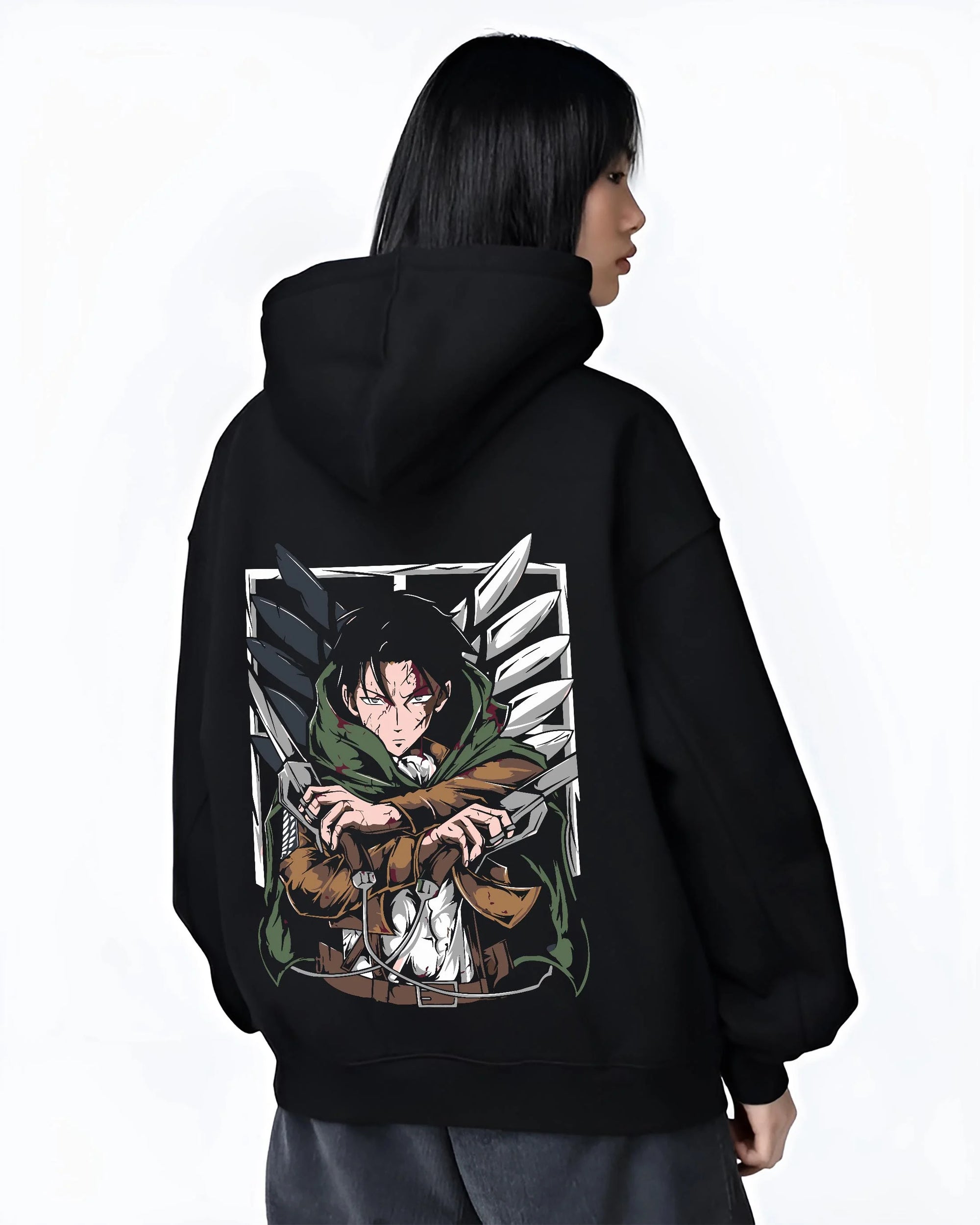 Black hoodie worn by female model, back view with Levi Ackerman Hoodie Attack on Titan Green Cloak Battle graphic premium wear.