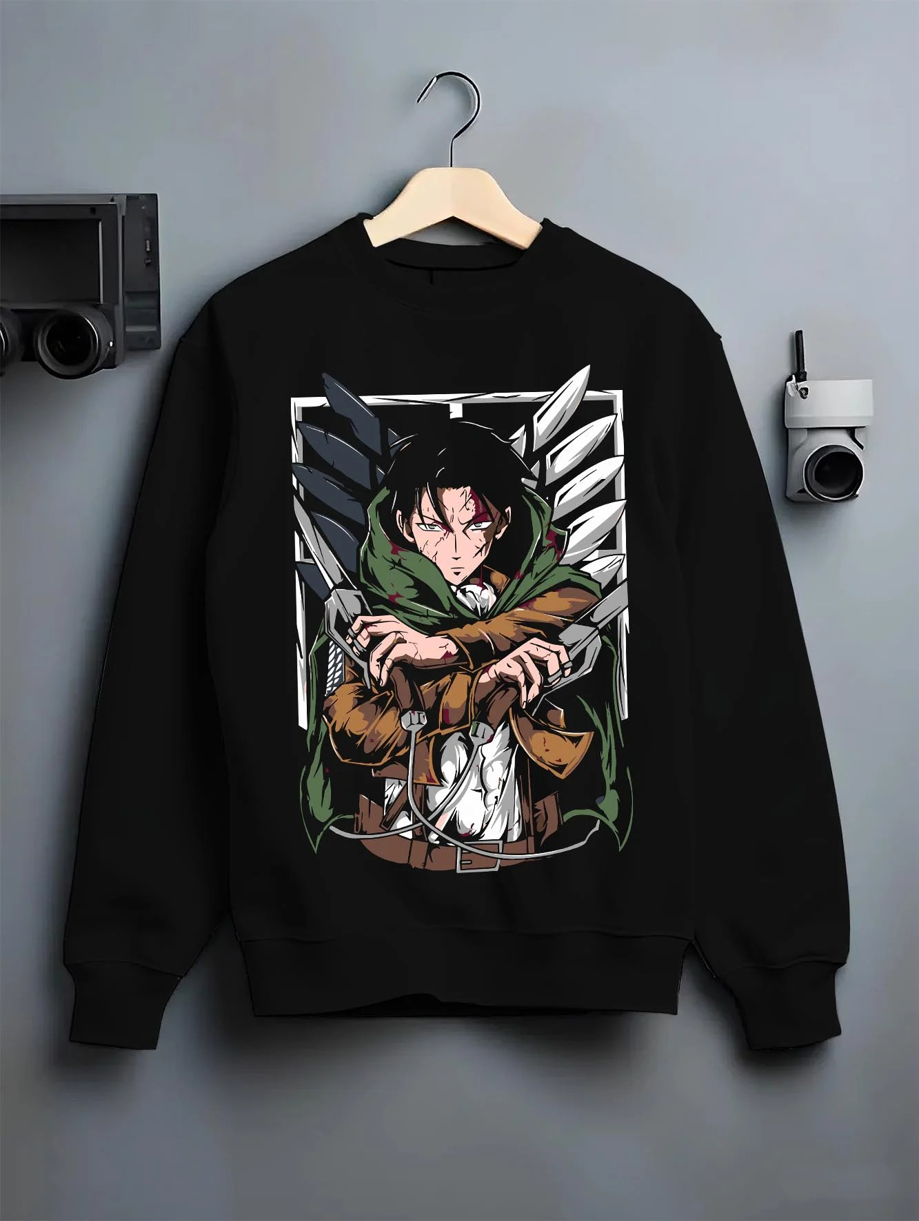 Black crewneck sweatshirt on hanger with Levi Ackerman Hoodie Attack on Titan Green Cloak Battle graphic streetwear graphic.