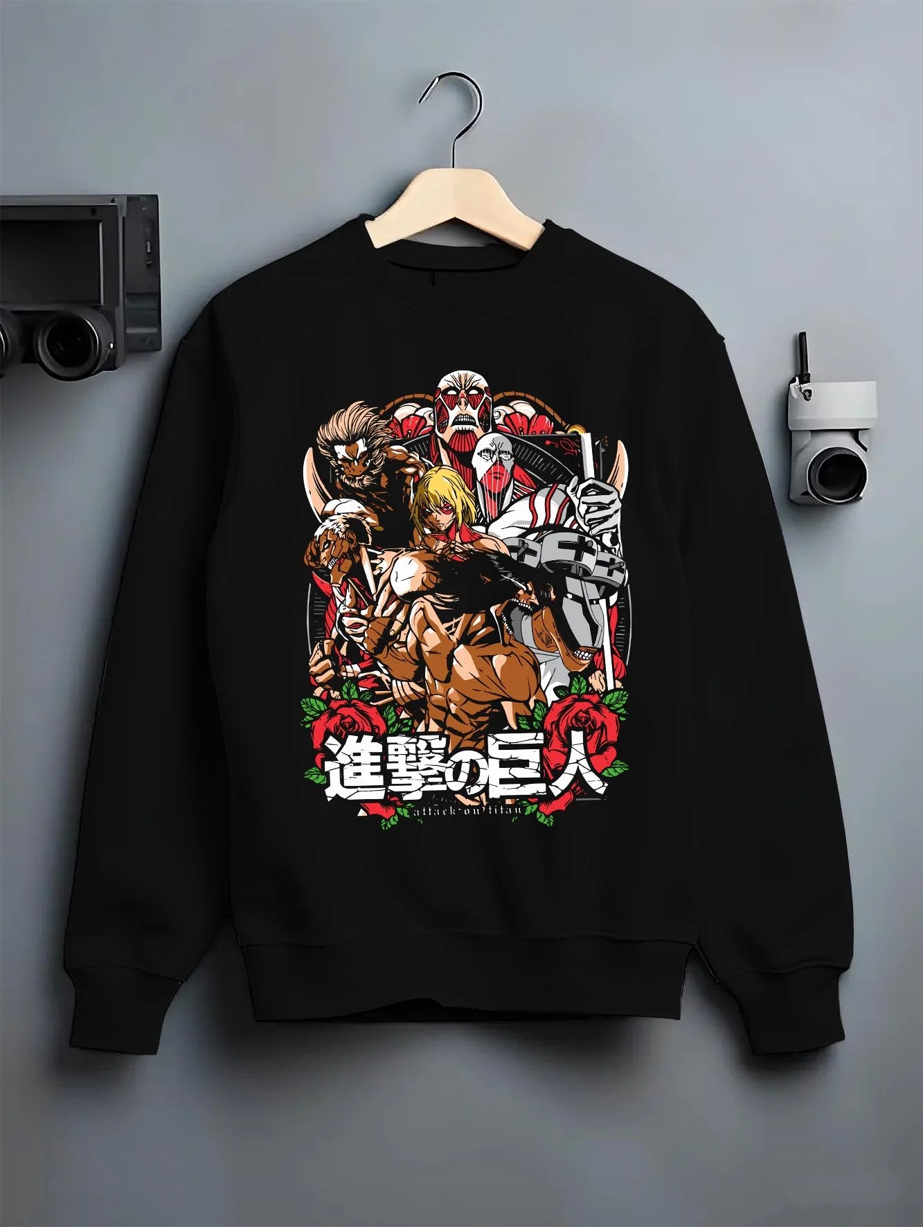 Black crewneck sweatshirt on hanger with Attack on Titan Hoodie Final Season Battle Manga Panel graphic premium wear.