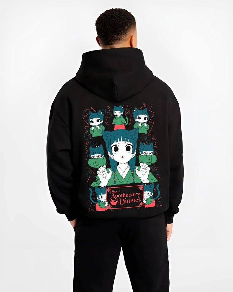 Black hoodie worn by male model, back view with Apothecary Diaries Hoodie Maomao Green Poison Dolls graphic bold anime graphic.