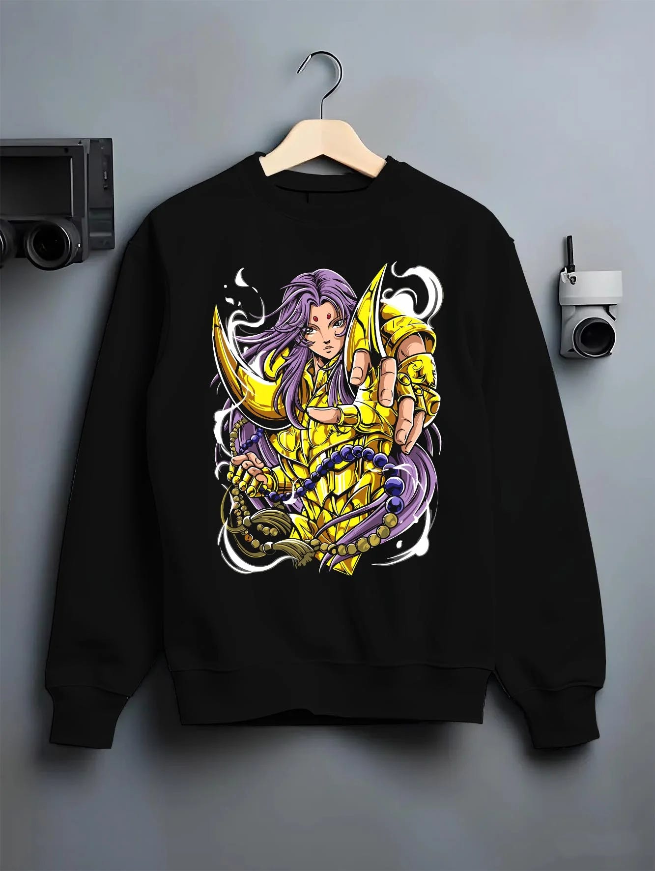 Black crewneck sweatshirt on hanger with Aries Gold Saint Hoodie Saint Seiya Celestial Zodiac graphic bold anime graphic.