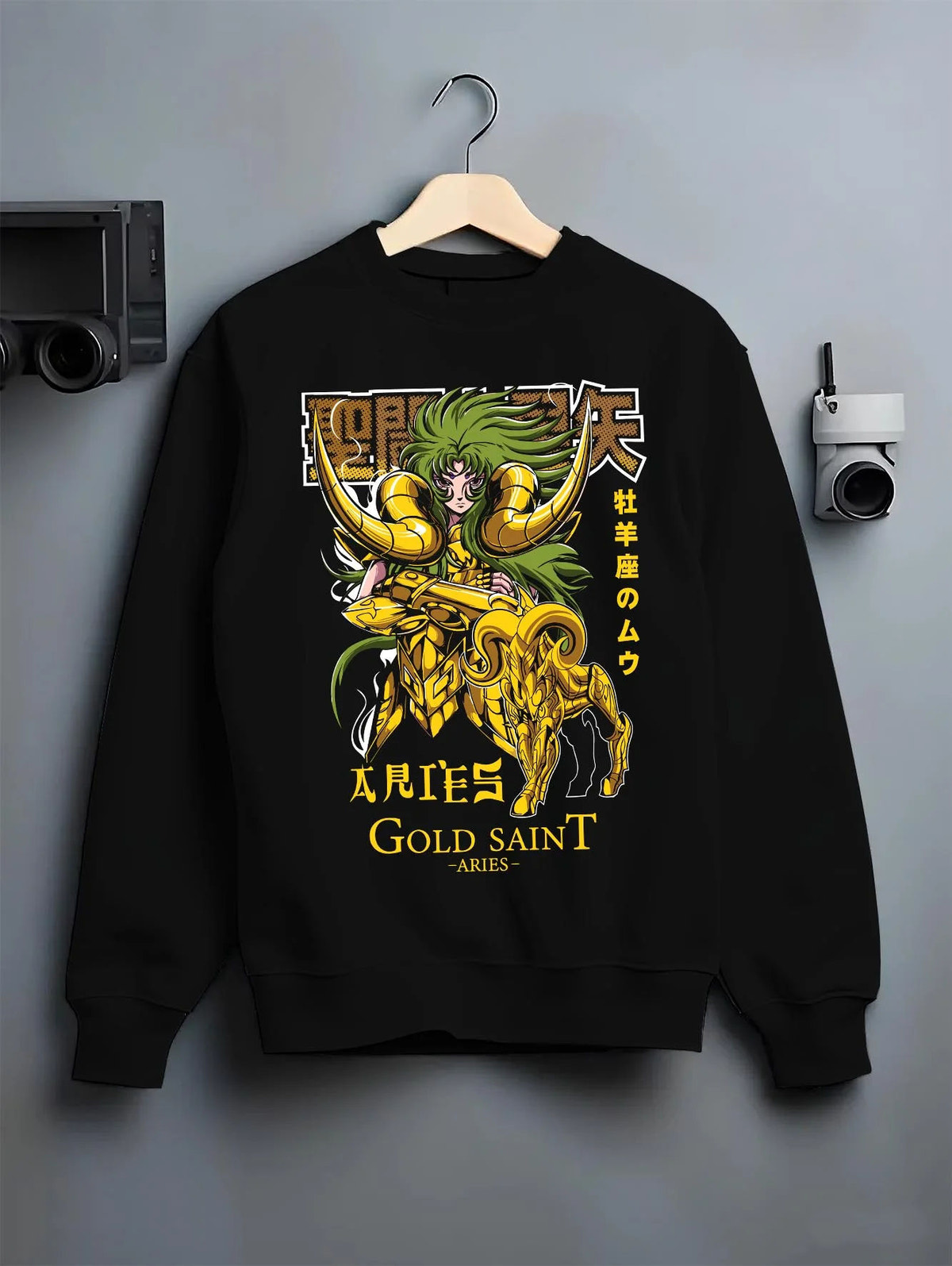 Black crewneck sweatshirt on hanger featuring Aries Mu Saint Seiya Gold Cloth cosmic artwork.