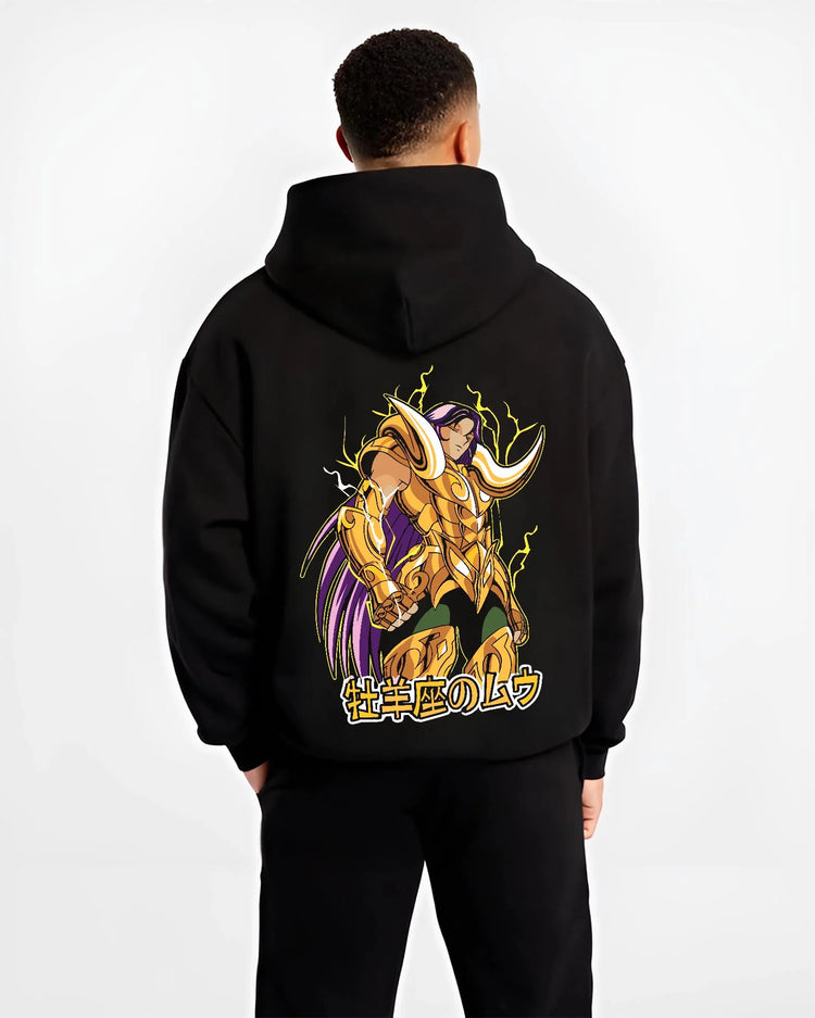 Black hoodie worn by male model, back view with Aries Gold Saint Hoodie Saint Seiya Cloth Armour Battle graphic streetwear graphic.