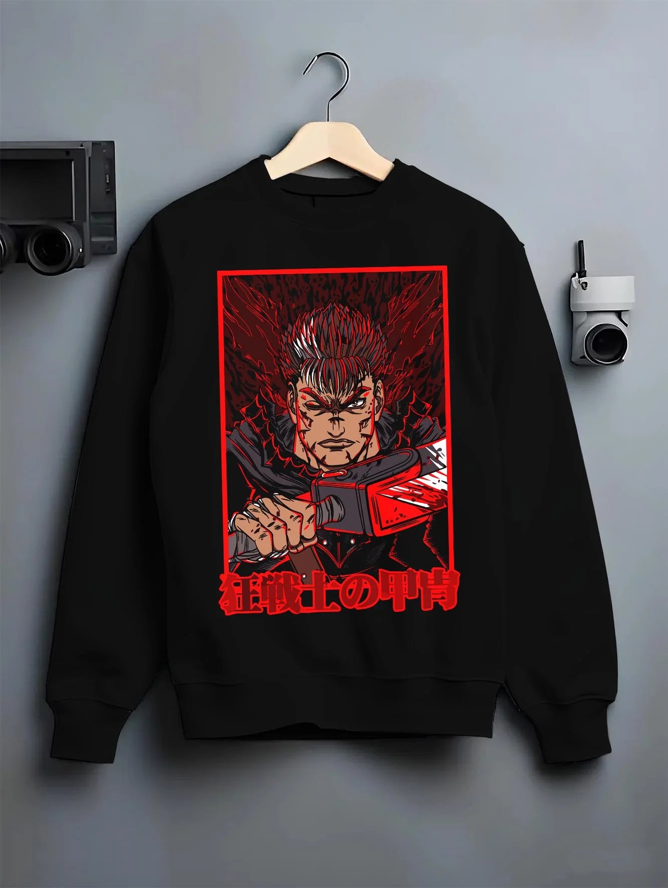 Black crewneck sweatshirt on hanger with Guts Berserk dark manga panel design styled as retro manga artwork Japanese animation streetwear.