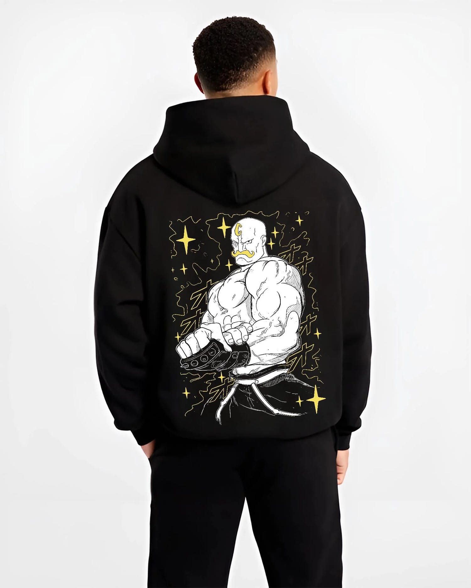 Black hoodie worn by male model, back view with Armstrong Hoodie Fullmetal Alchemist Strongman Alchemy graphic premium wear.