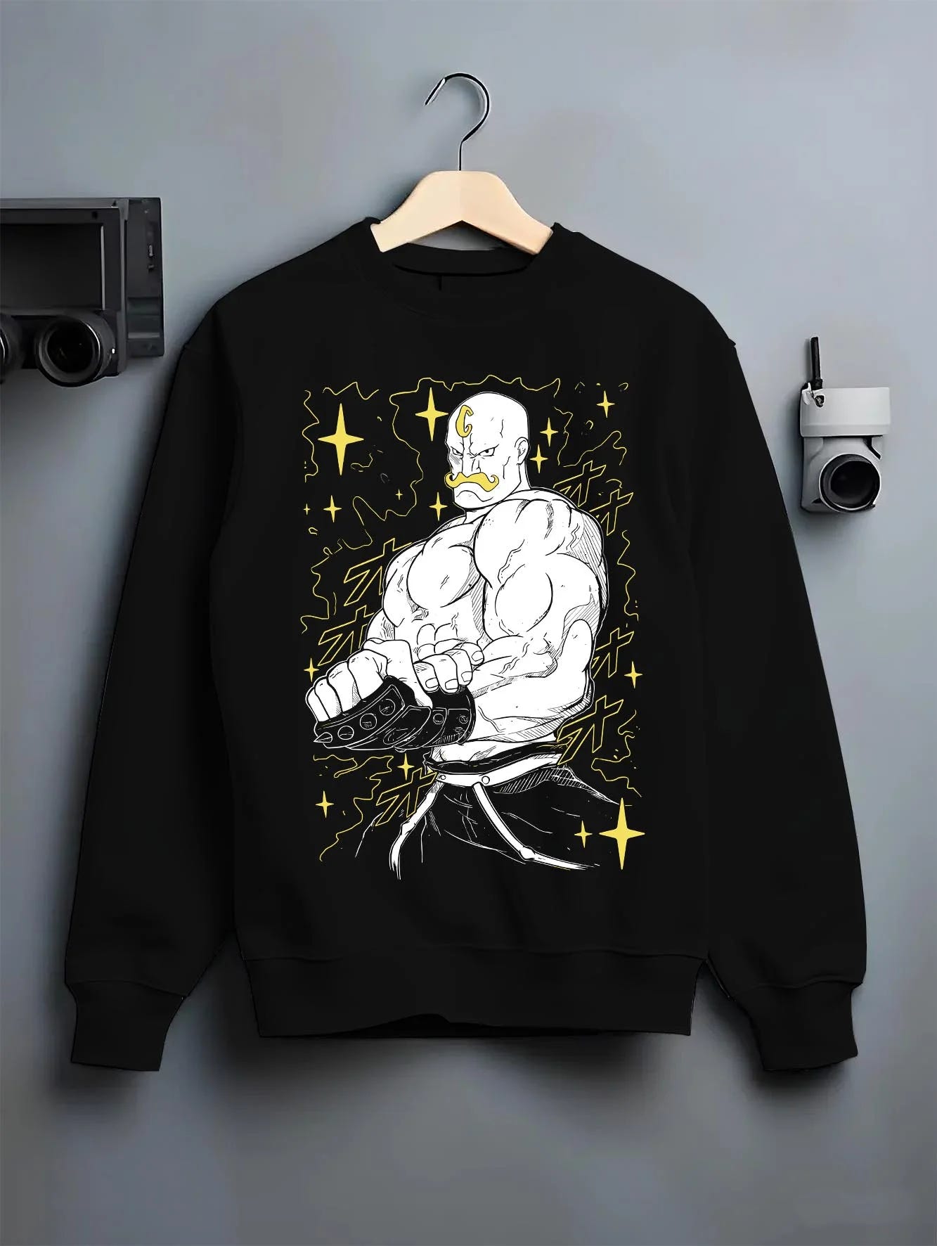 Black crewneck sweatshirt on hanger with Armstrong Hoodie Fullmetal Alchemist Strongman Alchemy graphic bold anime graphic.