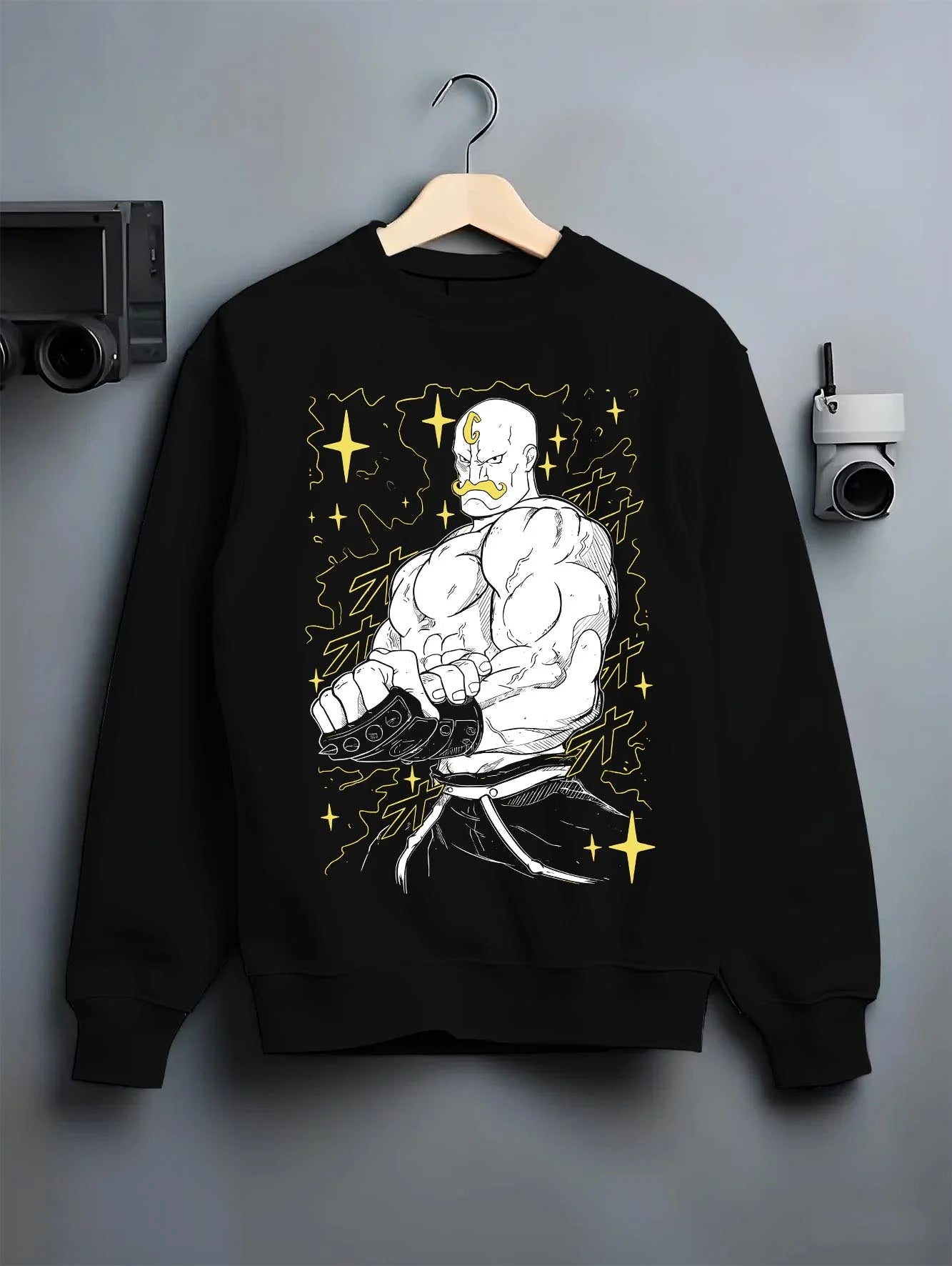 Black crewneck sweatshirt on hanger with Armstrong Hoodie Fullmetal Alchemist Strongman Alchemy graphic bold anime graphic.