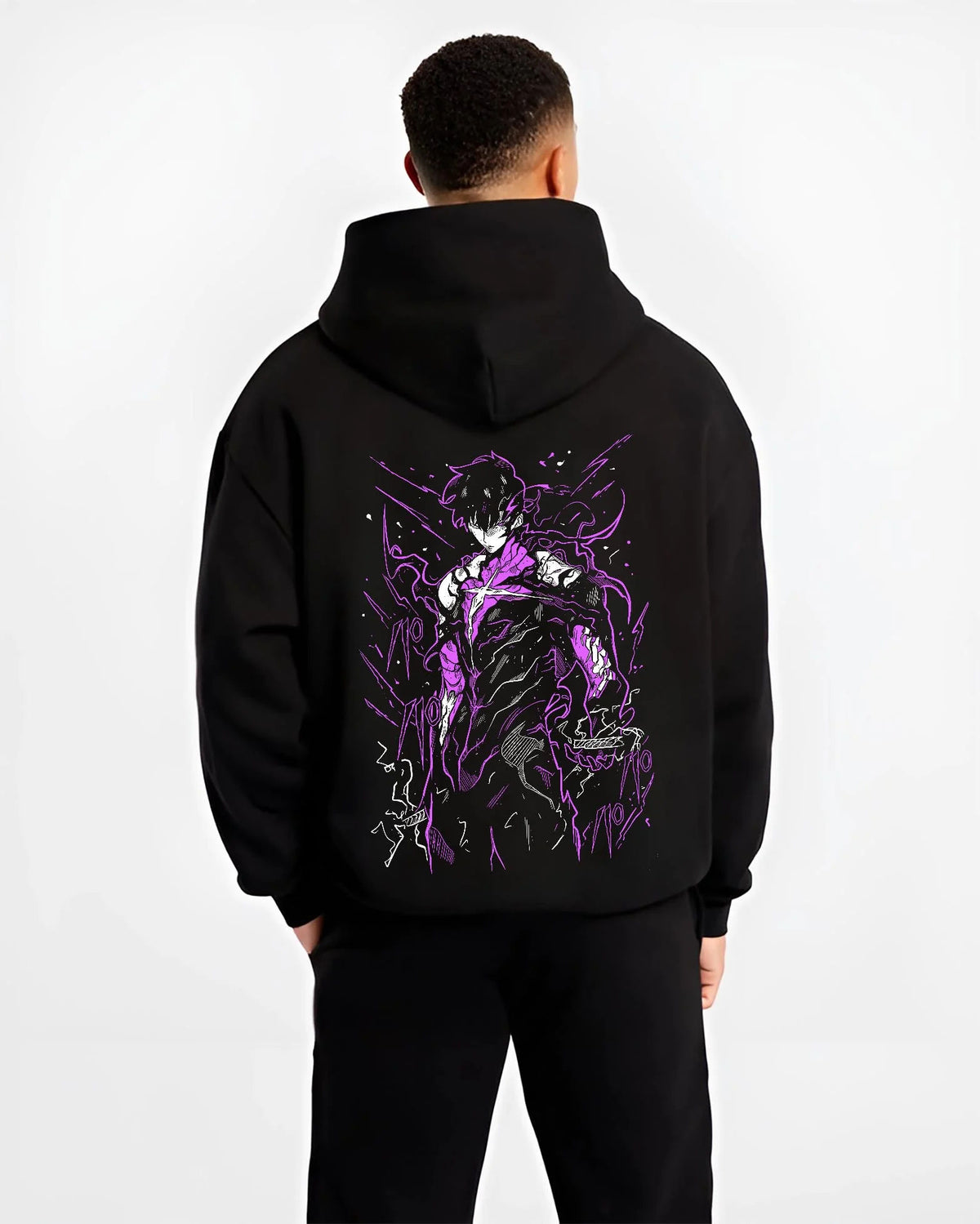 Black hoodie worn by male model from the back featuring Fullmetal Alchemist alchemy power dark artwork.