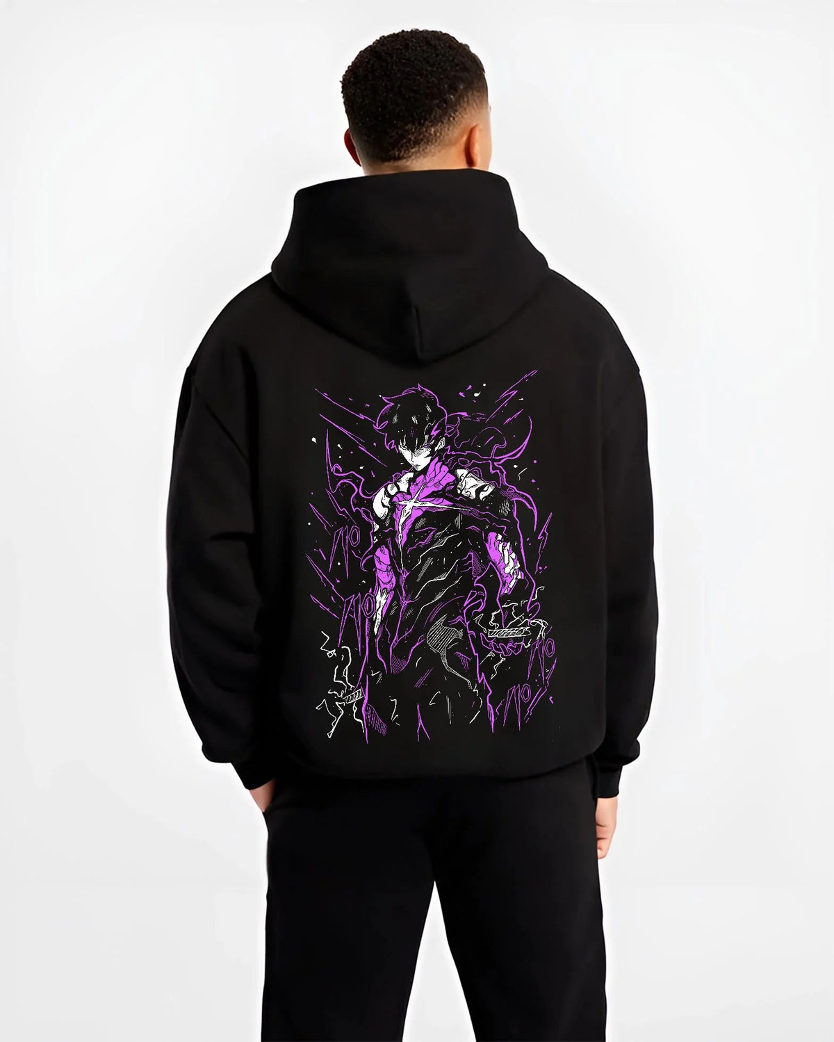 Black hoodie worn by male model from the back featuring Fullmetal Alchemist alchemy power dark artwork.