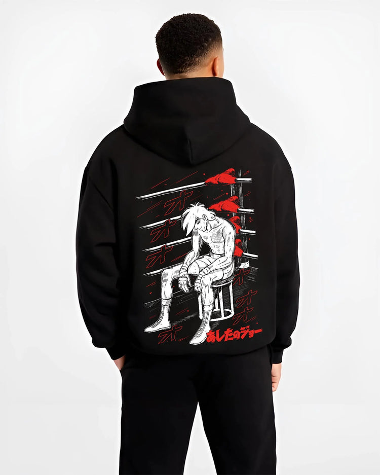 Black hoodie worn by male model, back view with Shiro Hoodie Great Pretender Retro Anime Chair Scene graphic premium wear.