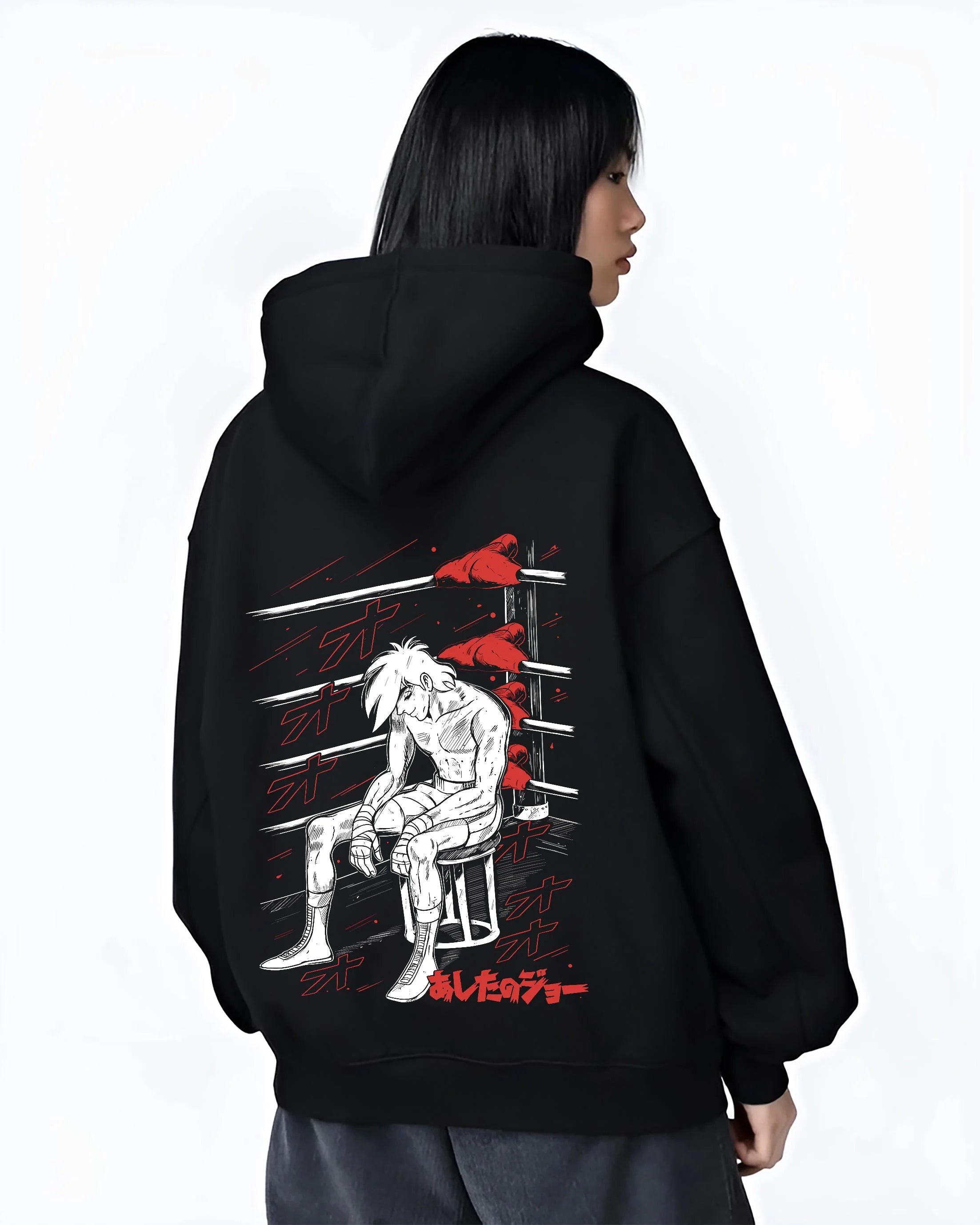 Black hoodie worn by female model, back view with Shiro Hoodie Great Pretender Retro Anime Chair Scene graphic streetwear graphic.