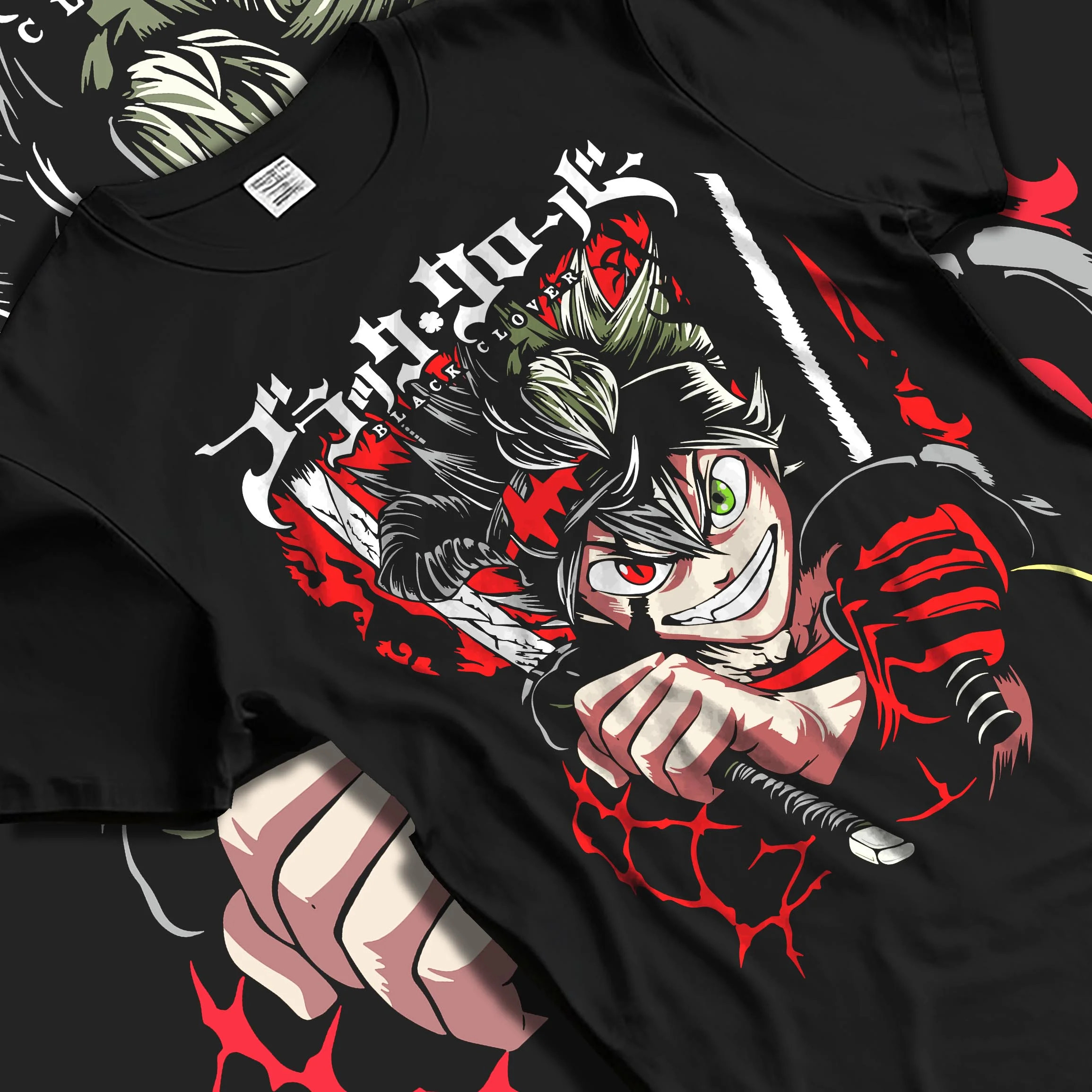 Black T-shirt laid flat with natural folds with Asta Battle Hoodie Black Clover Fierce Grin Warrior graphic premium wear.