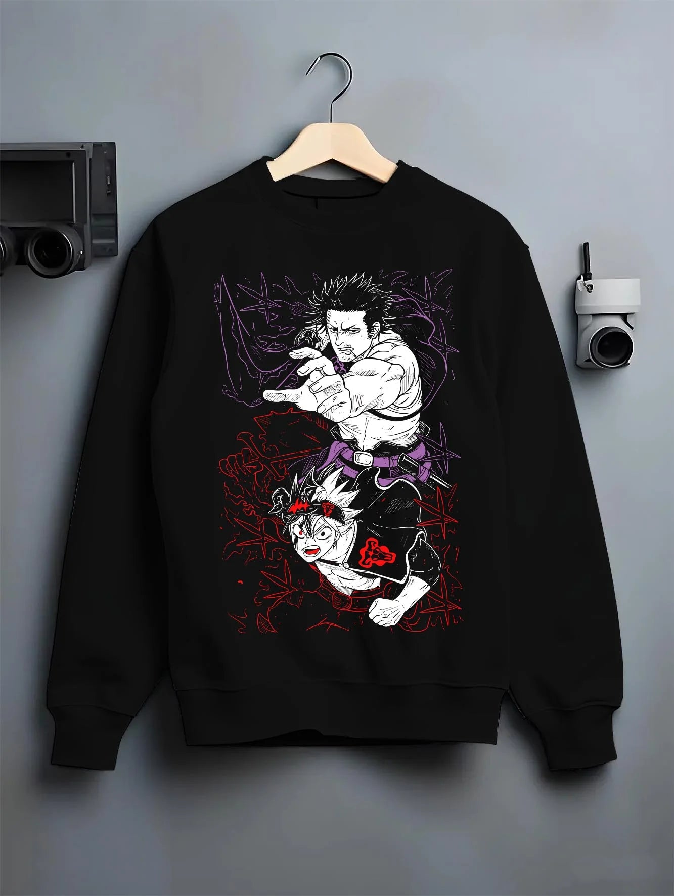 Black crewneck sweatshirt on hanger with Asta Dark Grimoire Hoodie Black Clover Inferno Power graphic streetwear graphic.