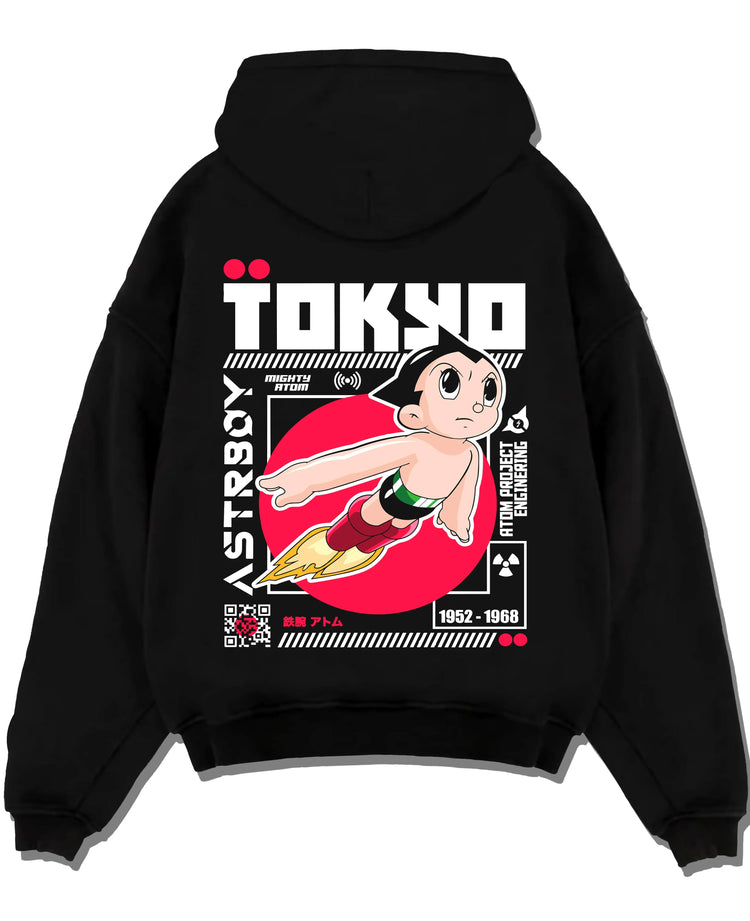 Black pullover hoodie laid flat with Astro Boy Hoodie Retro Tokyo Anime Robot Hero Poster graphic bold anime graphic.