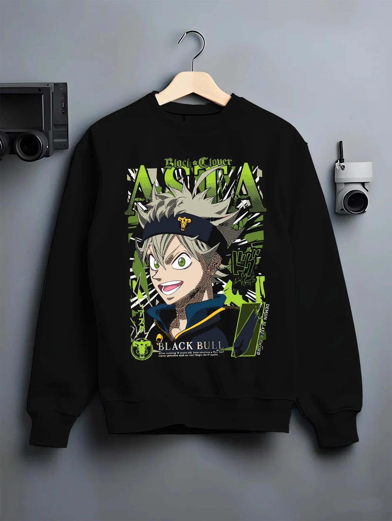 Black crewneck sweatshirt on hanger with Asta Grimoire Hoodie Black Clover Green Magic Energy graphic Asta themed artwork.