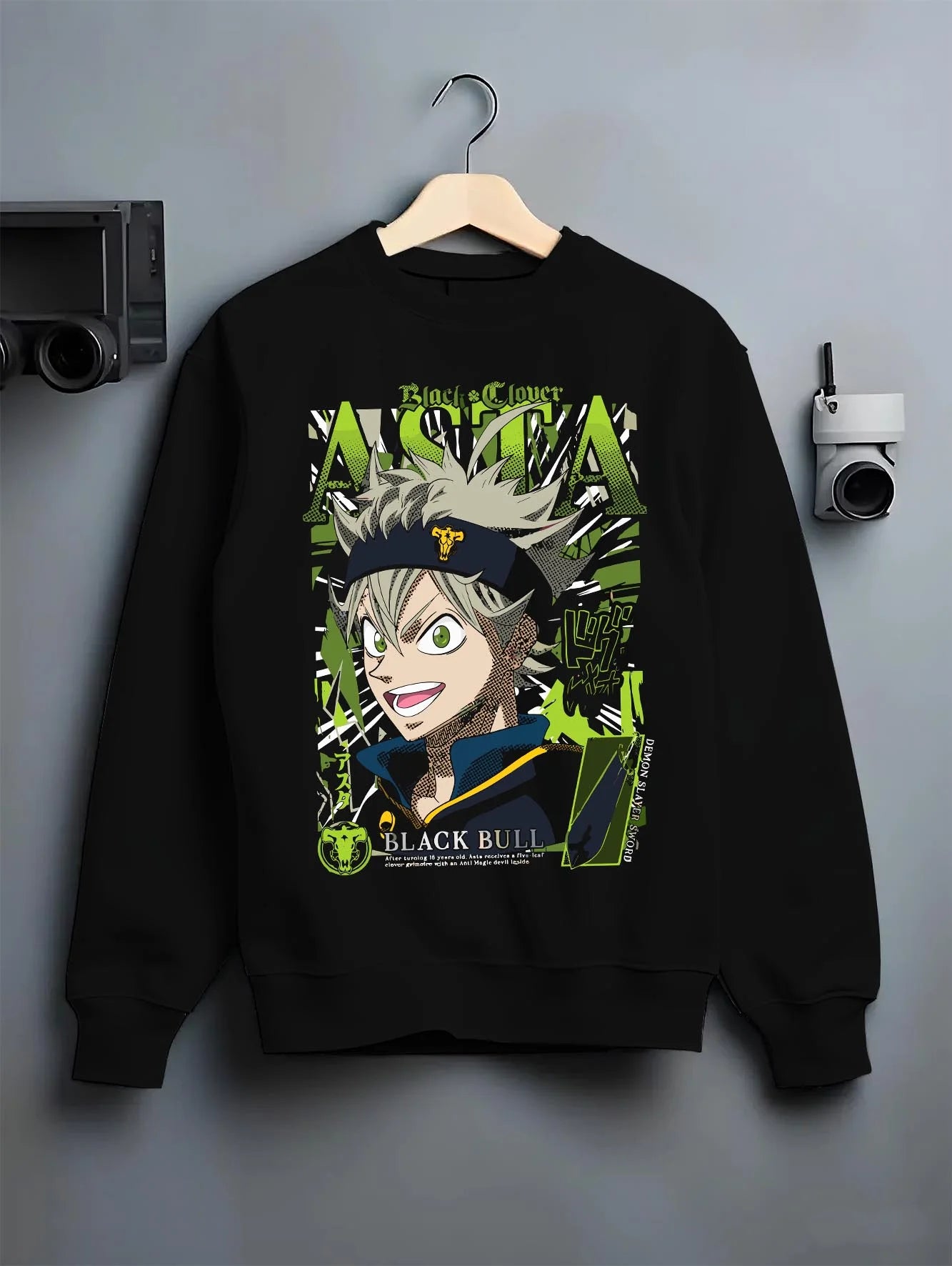 Black crewneck sweatshirt on hanger with Asta Grimoire Hoodie Black Clover Green Magic Energy graphic Asta themed artwork.