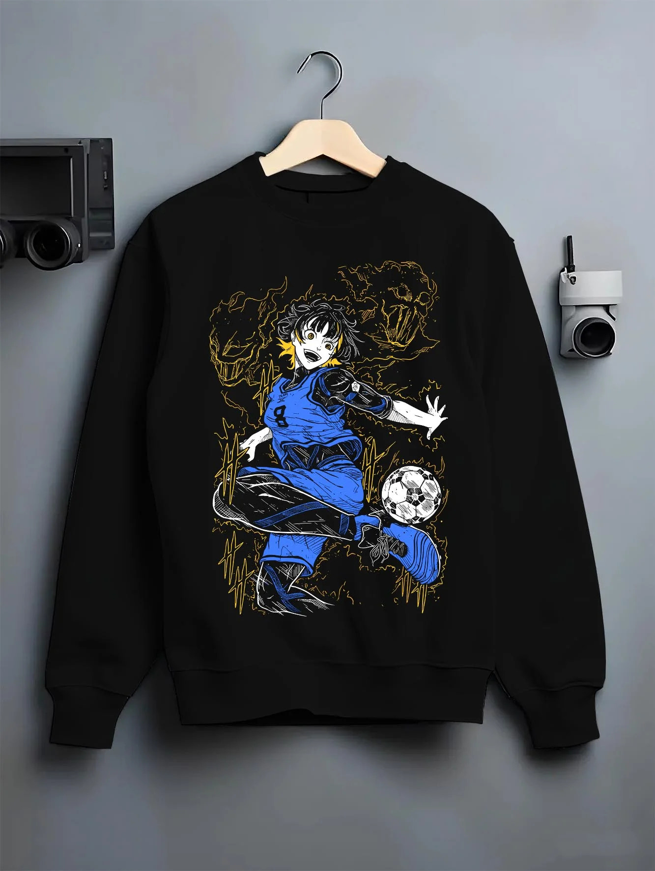 Black crewneck sweatshirt on hanger with Blue Lock Bachira Hoodie Dynamic Soccer Striker Jumper graphic streetwear graphic.