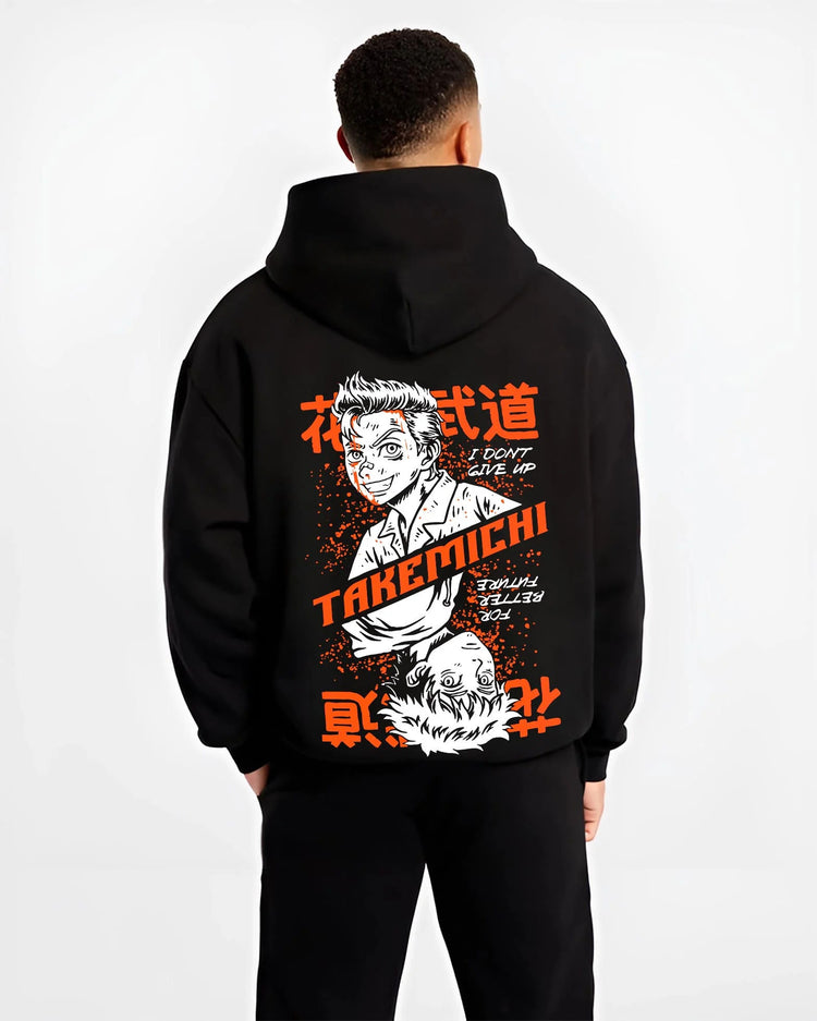 Black hoodie worn by male model from the back featuring Baji Keisuke Tokyo Revengers street manga artwork.