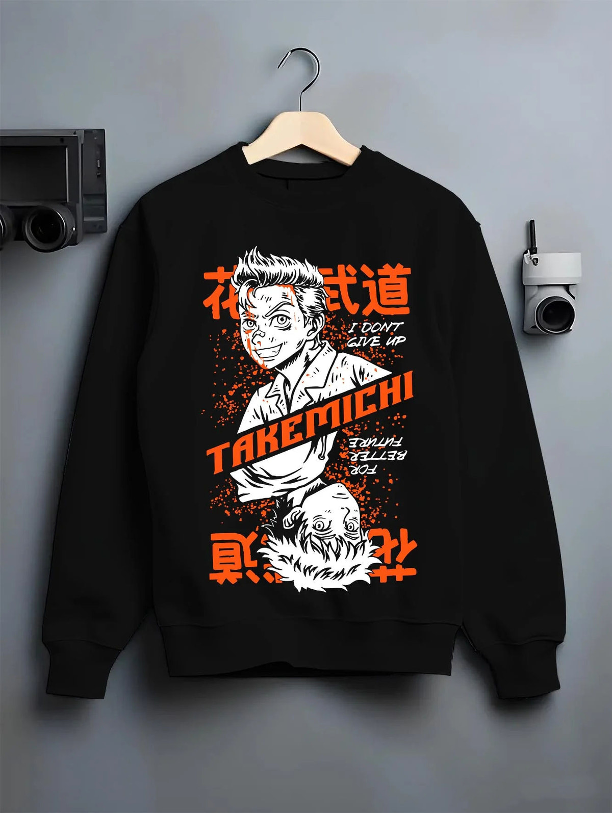 Black crewneck sweatshirt on hanger featuring Baji Keisuke Tokyo Revengers street manga artwork.