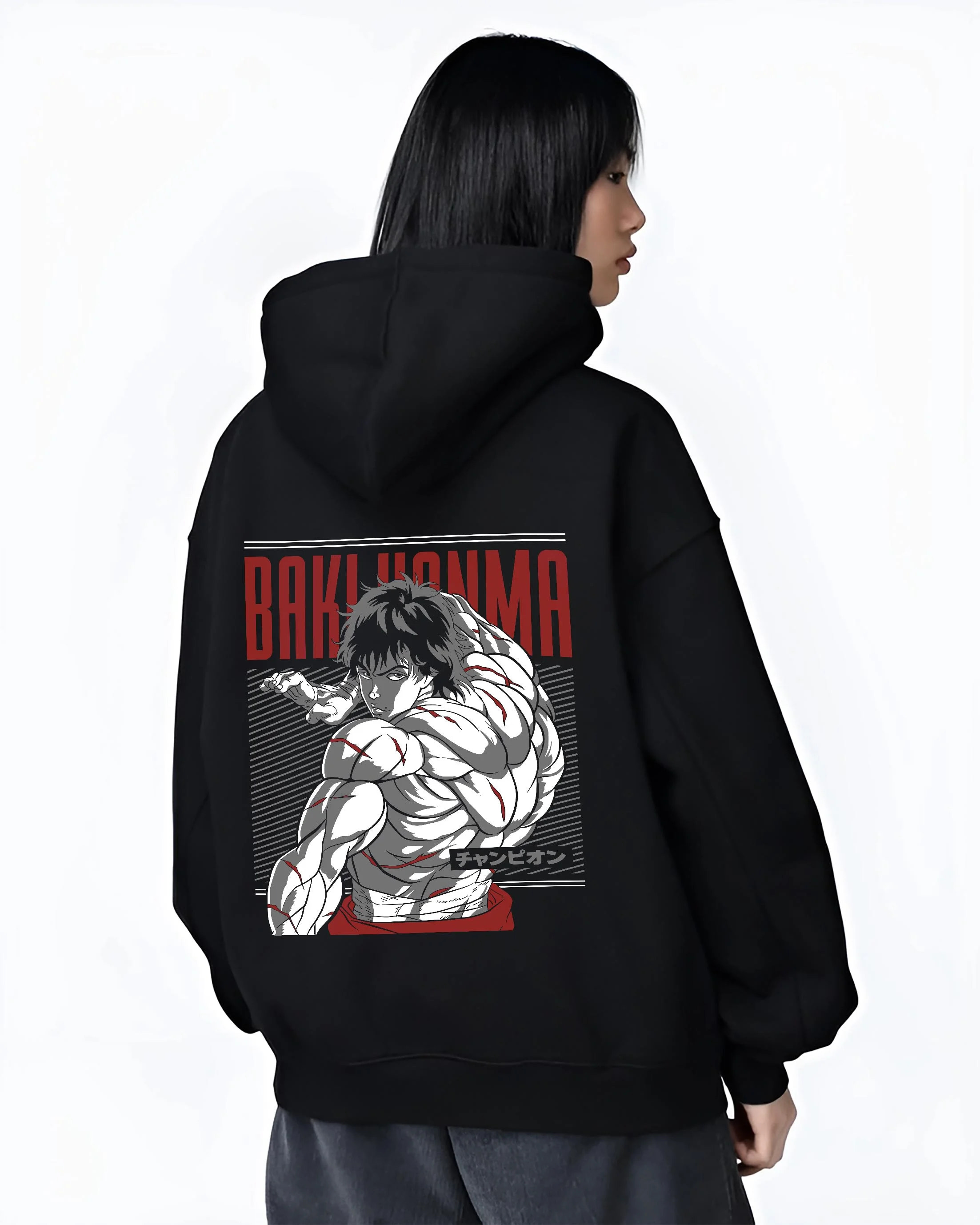 Black hoodie worn by female model, back view with Baki Hanma Hoodie Grappler Baki Martial Arts Fighter graphic bold anime graphic.
