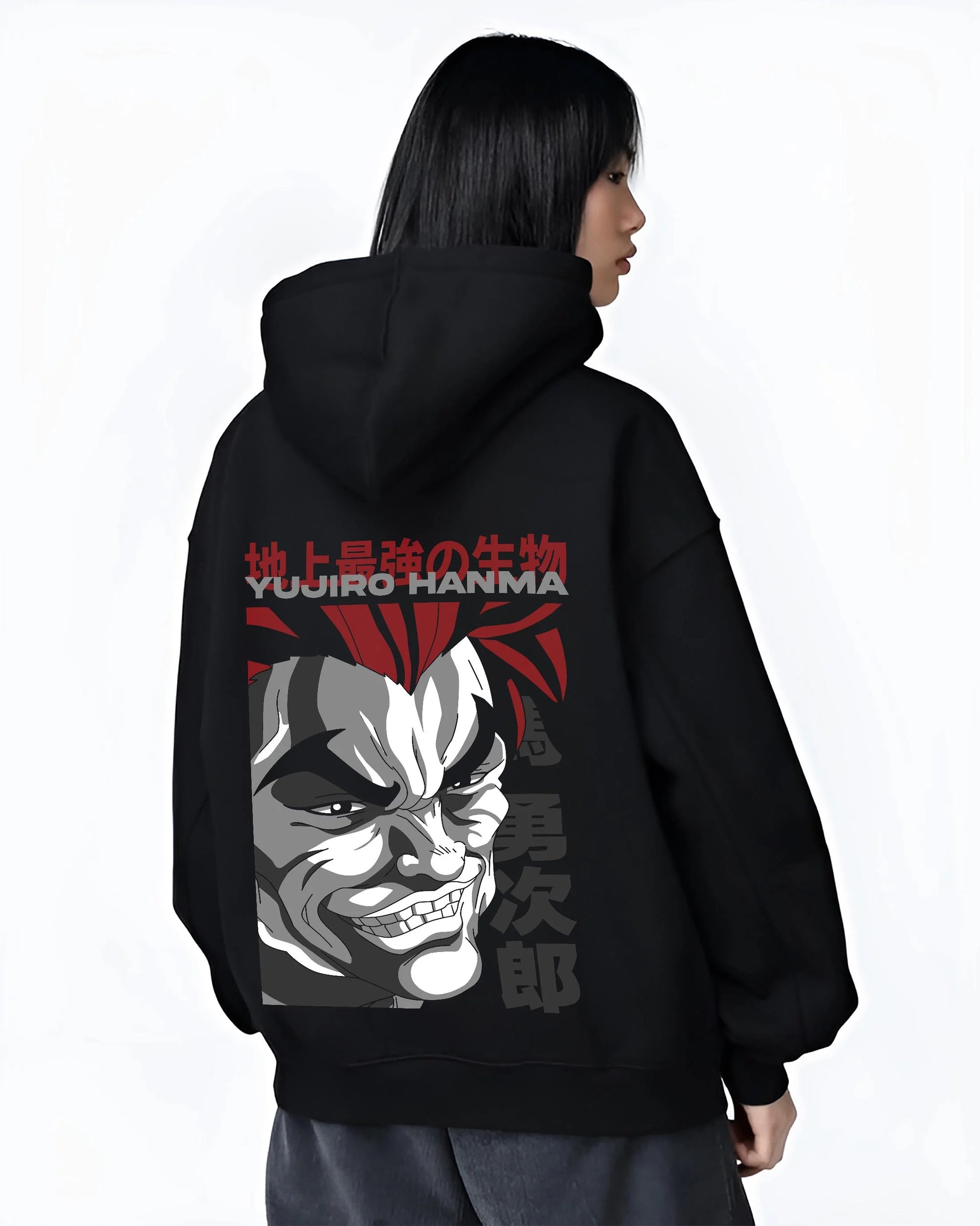 Black hoodie worn by female model, back view with Yujiro Hanma Hoodie Baki the Grappler Fierce Grin graphic streetwear graphic.