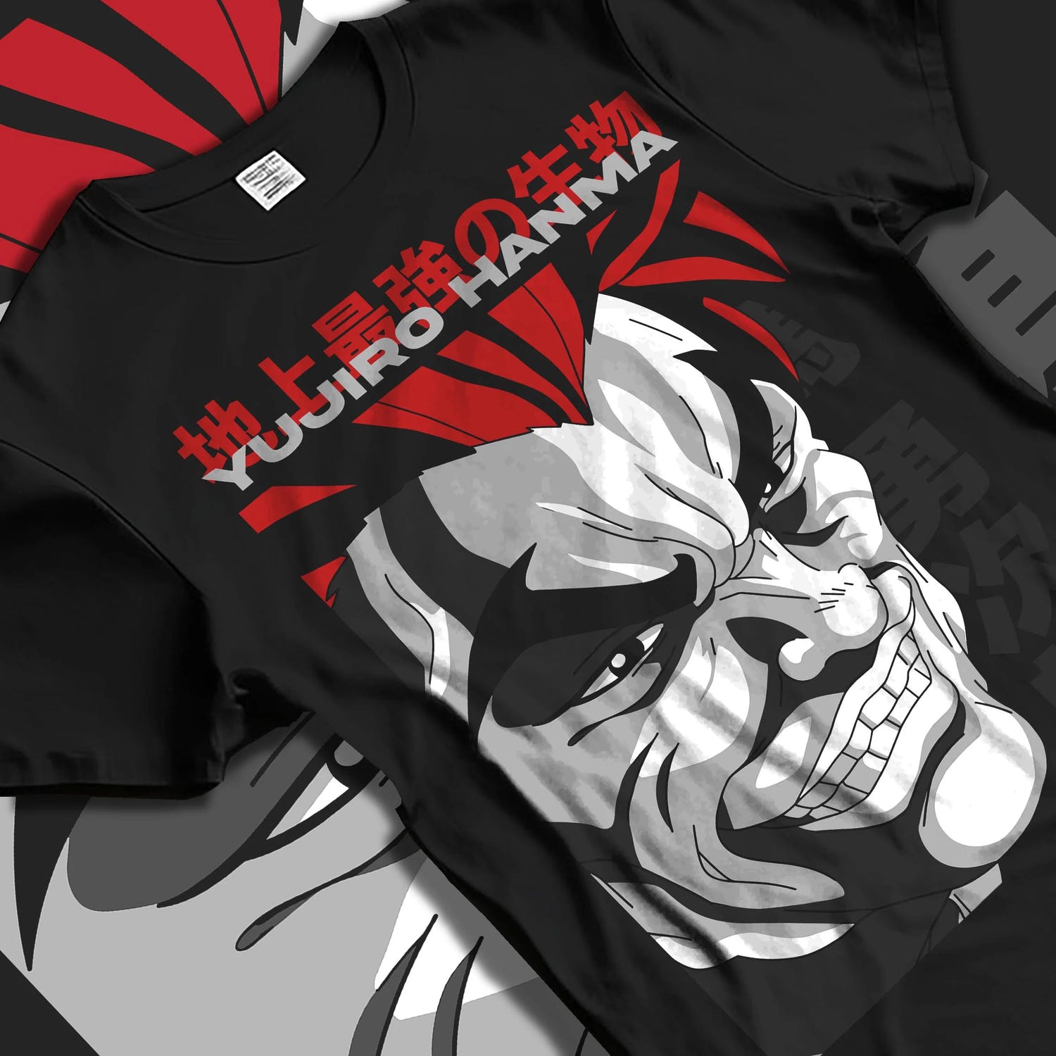 Black T-shirt laid flat with natural folds with Yujiro Hanma Hoodie Baki the Grappler Fierce Grin graphic premium wear.