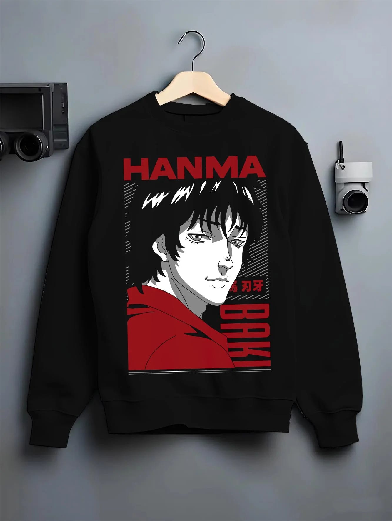 Black crewneck sweatshirt on hanger with Baki Hanma Fighter Hoodie Classic Retro Anime Jumper graphic premium wear.