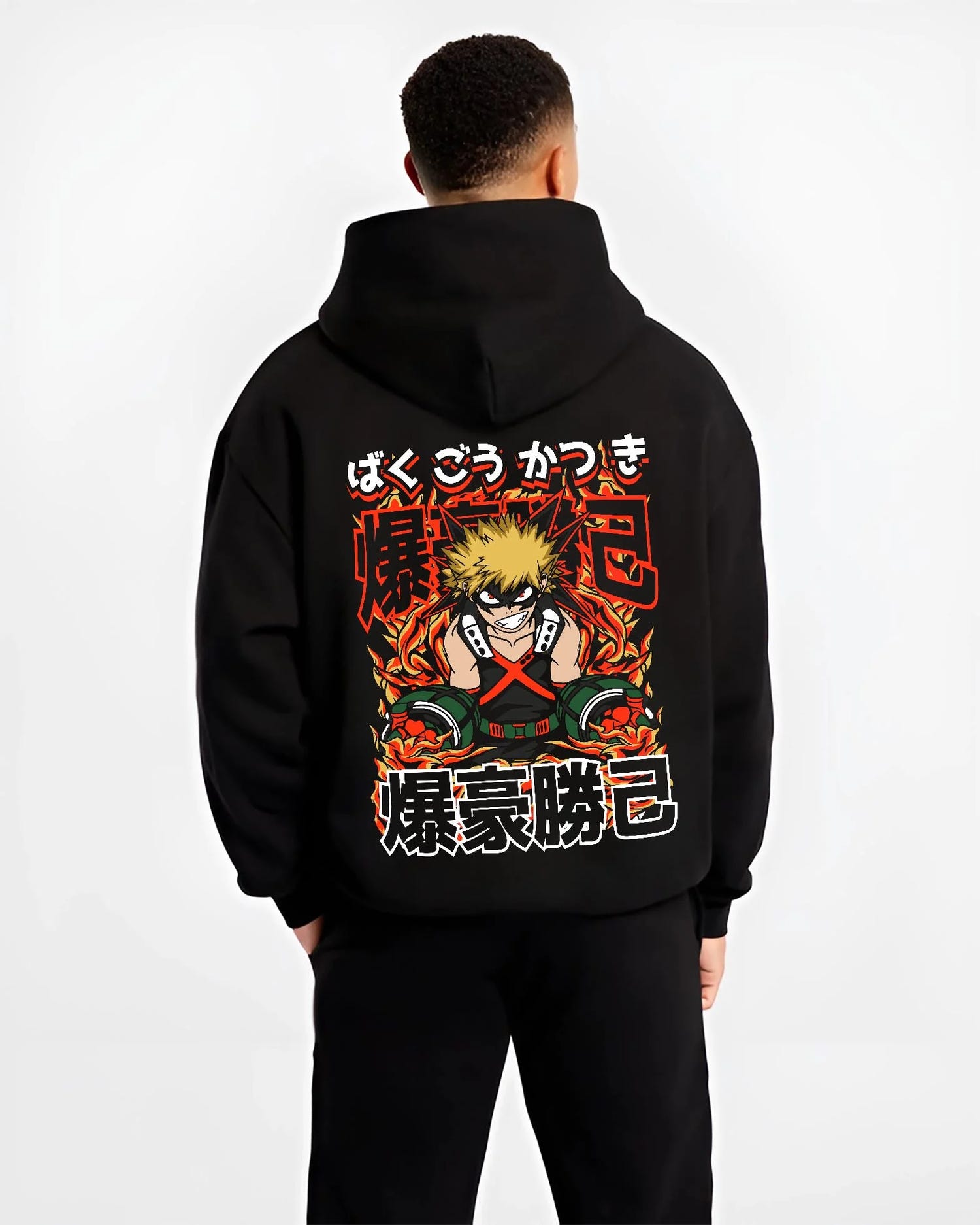 Black hoodie worn by male model, back view with Bakugo Explosion Hoodie My Hero Academia Blazing Rage graphic streetwear graphic.