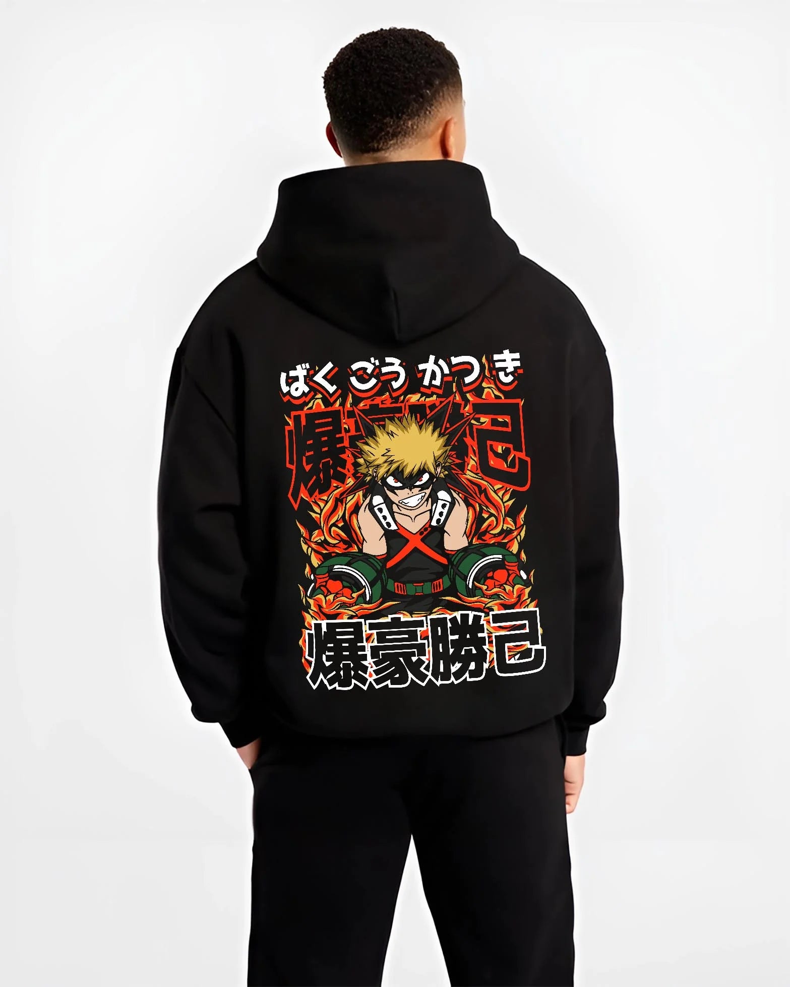Black hoodie worn by male model, back view with Bakugo Explosion Hoodie My Hero Academia Blazing Rage graphic streetwear graphic.