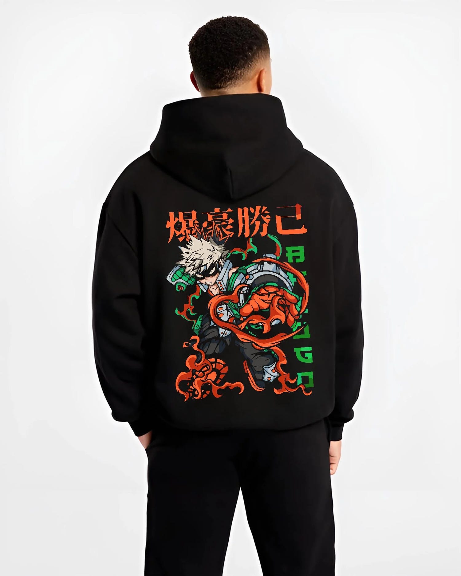Black hoodie worn by male model, back view with Bakugo Power Hoodie My Hero Academia Inferno Battle graphic streetwear graphic.