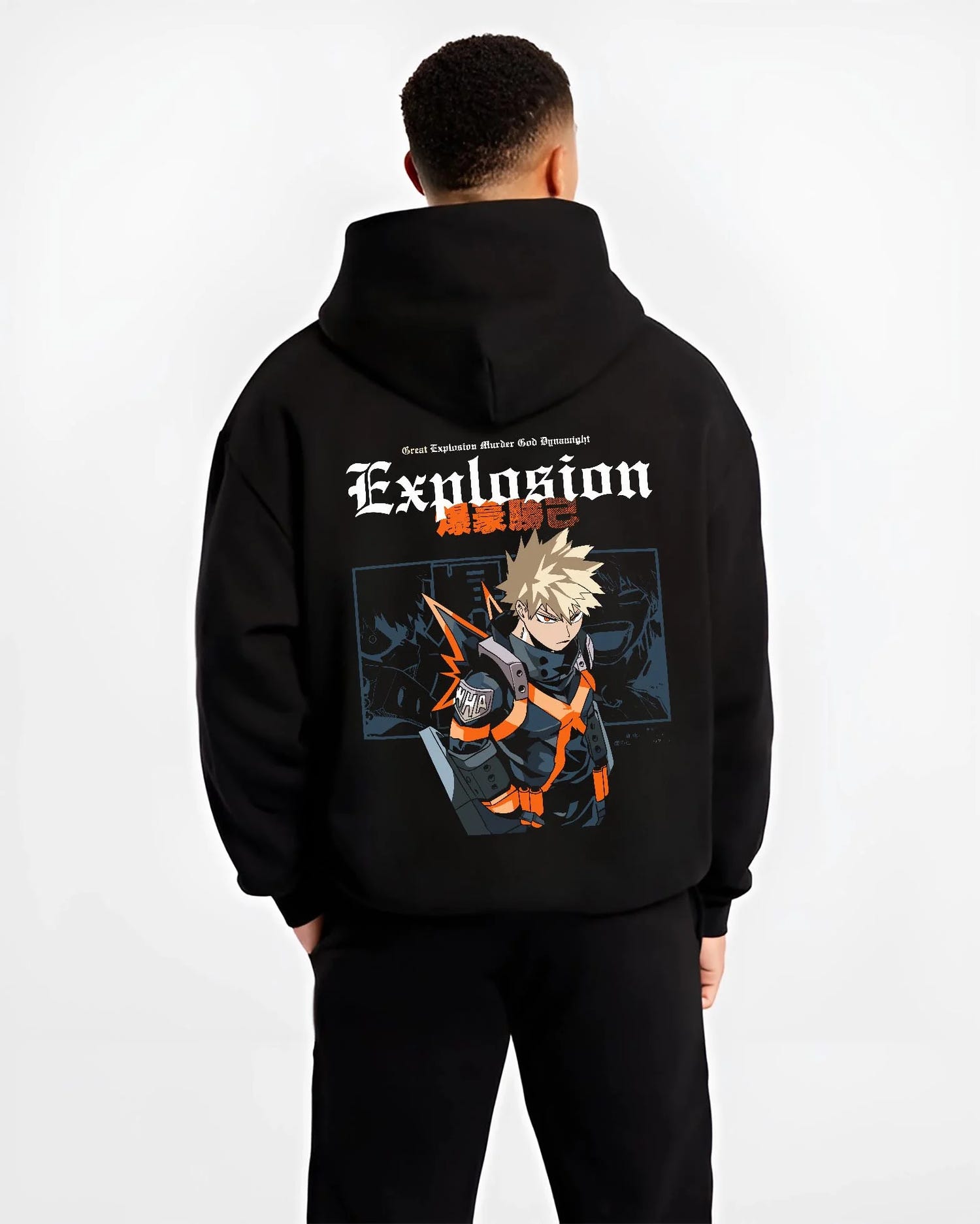 Black hoodie worn by male model, back view with Bakugo Hero Hoodie My Hero Academia Fierce Blast Pose graphic bold anime graphic.