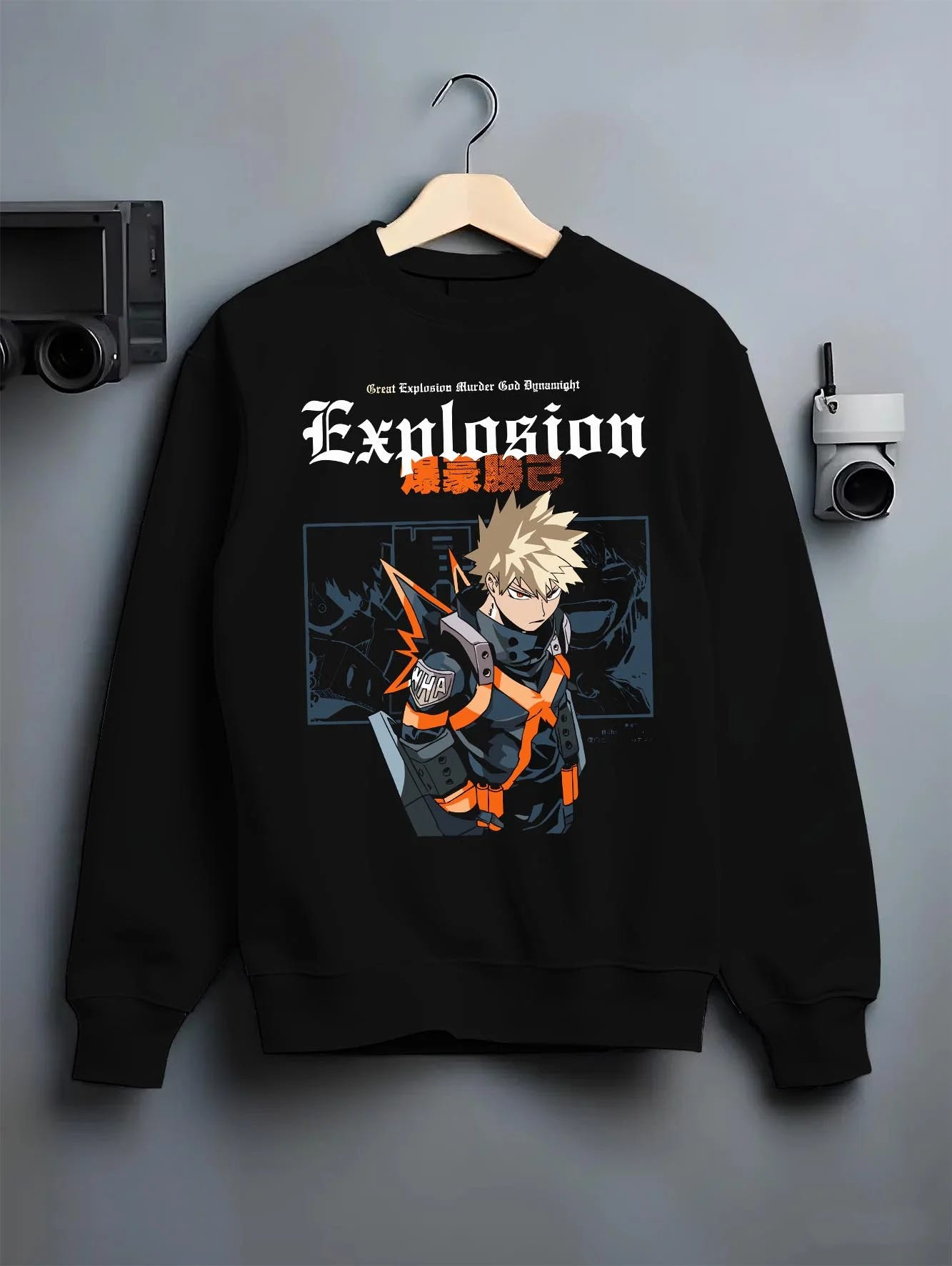 Black crewneck sweatshirt on hanger with Bakugo Hero Hoodie My Hero Academia Fierce Blast Pose graphic streetwear graphic.
