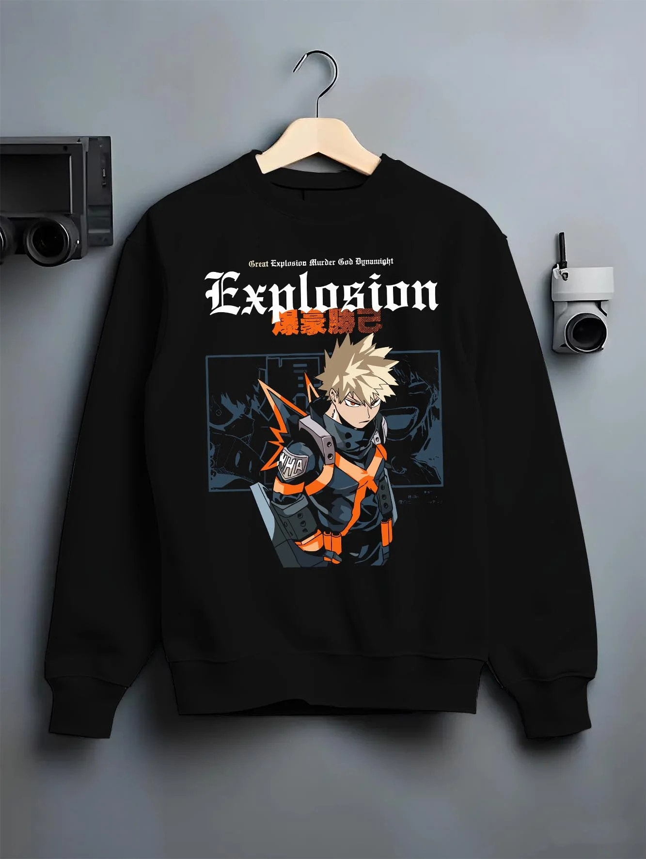 Black crewneck sweatshirt on hanger with Bakugo Hero Hoodie My Hero Academia Fierce Blast Pose graphic streetwear graphic.
