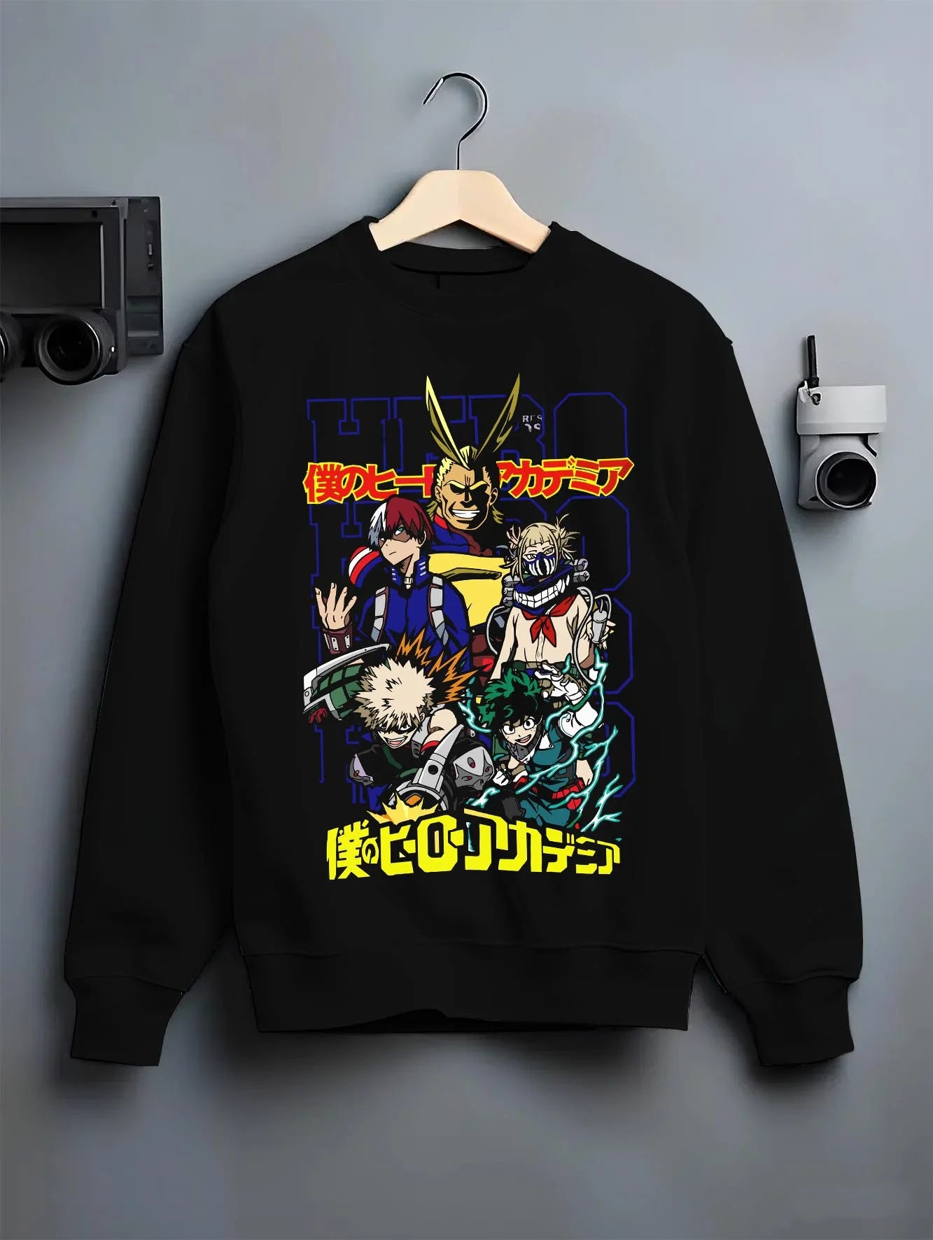 Black crewneck sweatshirt on hanger with My Hero Academia Bakugo Hoodie Explosion Quirk Jumper graphic premium wear.