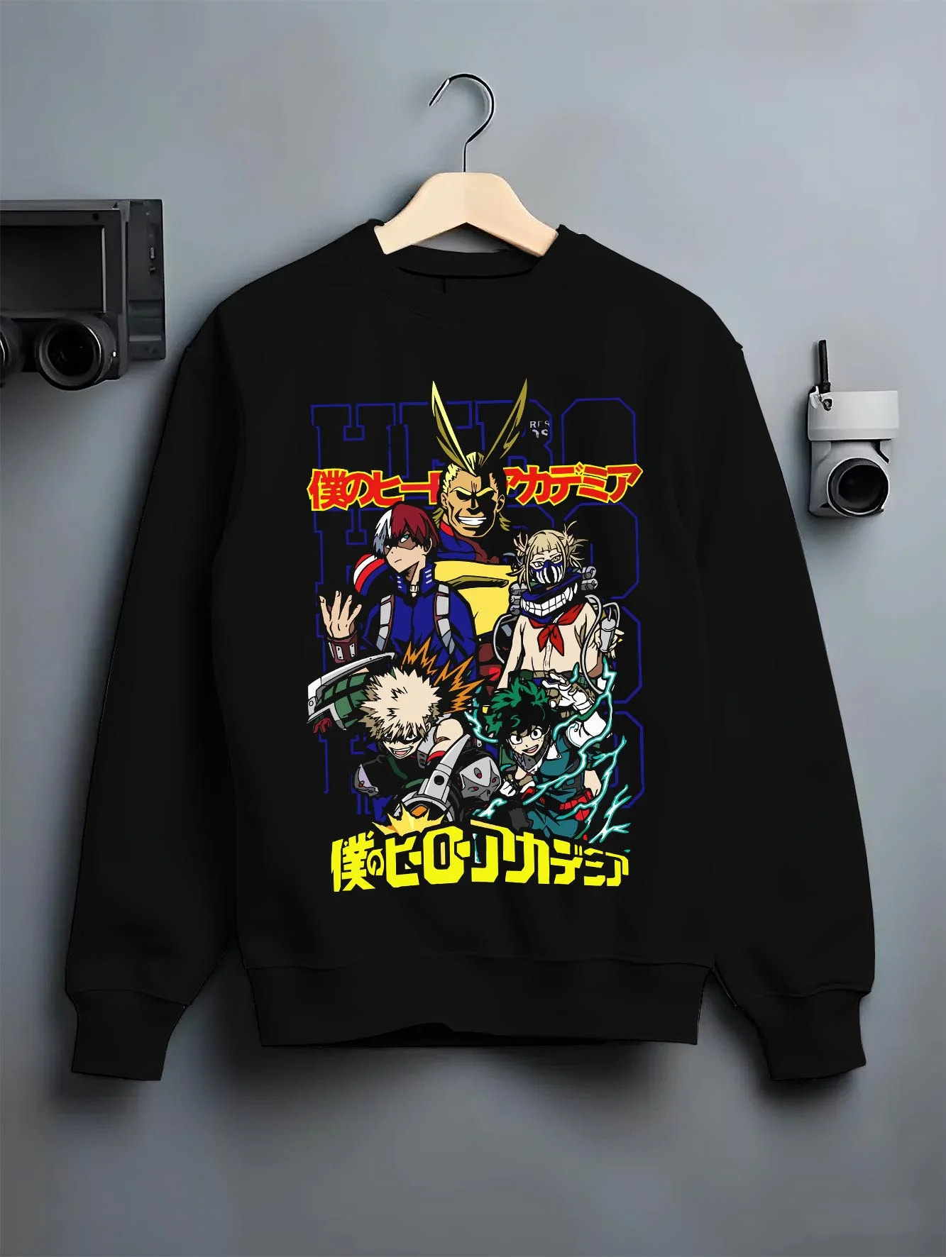 Black crewneck sweatshirt on hanger with My Hero Academia Bakugo Hoodie Explosion Quirk Jumper graphic premium wear.