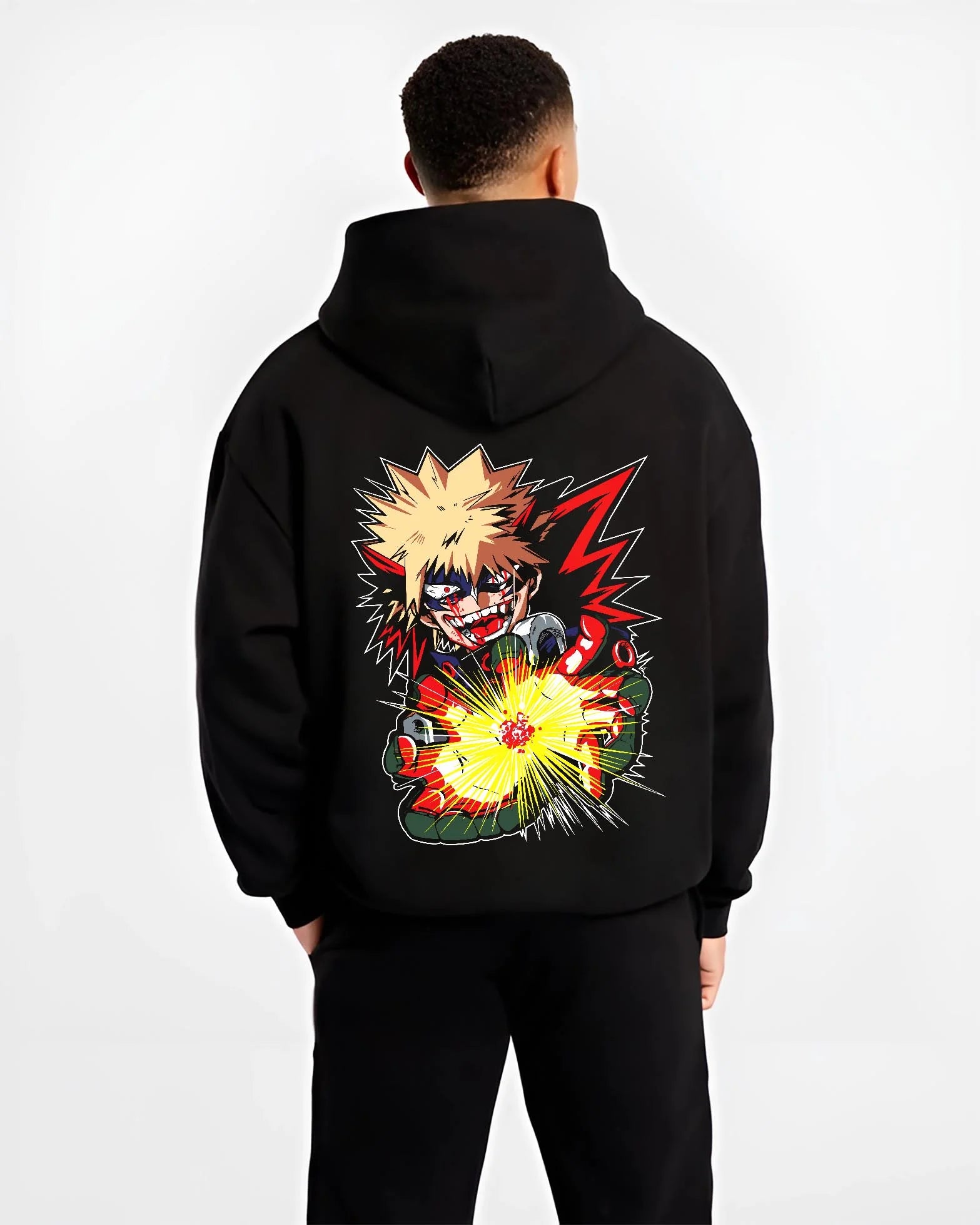 Black hoodie worn by male model, back view with Bakugo Explosion Hoodie My Hero Academia Blazing Blast graphic streetwear graphic.