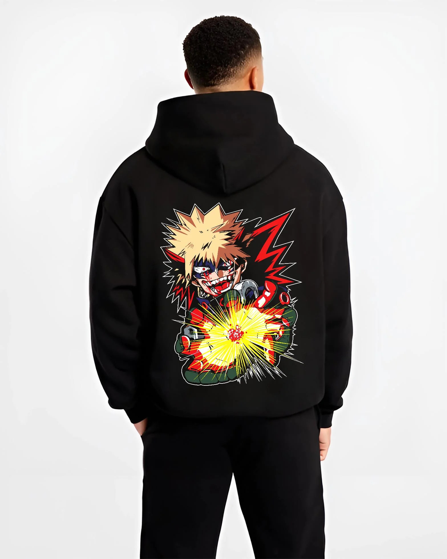 Black hoodie worn by male model, back view with Bakugo Explosion Hoodie My Hero Academia Blazing Blast graphic streetwear graphic.
