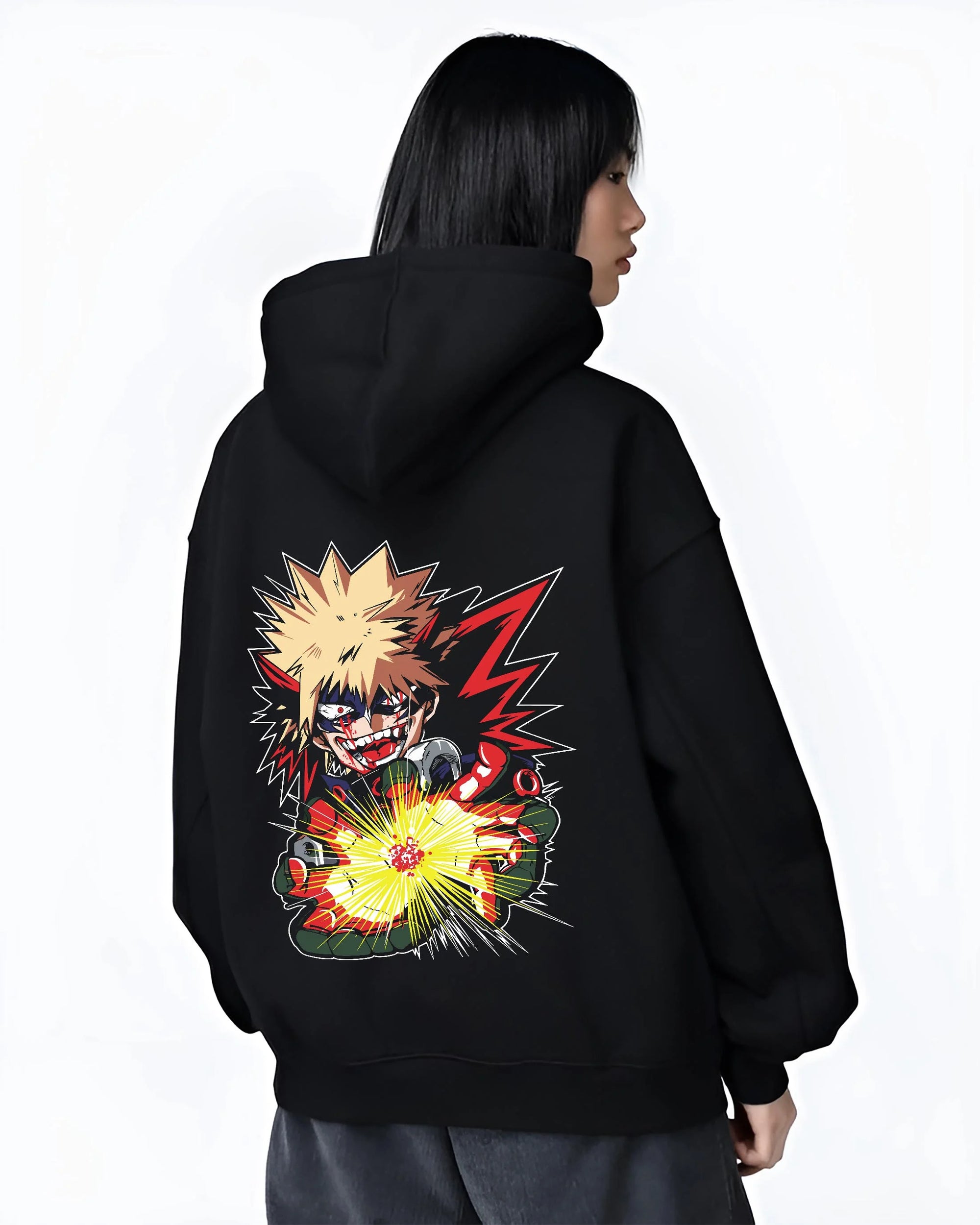 Black hoodie worn by female model, back view with Bakugo Explosion Hoodie My Hero Academia Blazing Blast graphic streetwear graphic.