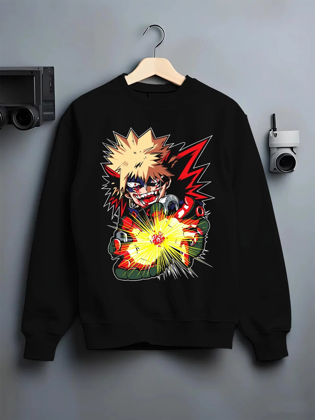 Black crewneck sweatshirt on hanger with Bakugo Explosion Hoodie My Hero Academia Blazing Blast graphic bold anime graphic.