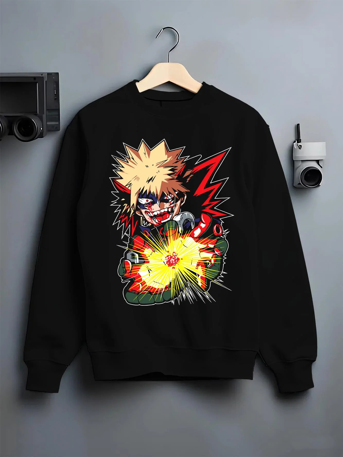Black crewneck sweatshirt on hanger with Bakugo Explosion Hoodie My Hero Academia Blazing Blast graphic bold anime graphic.