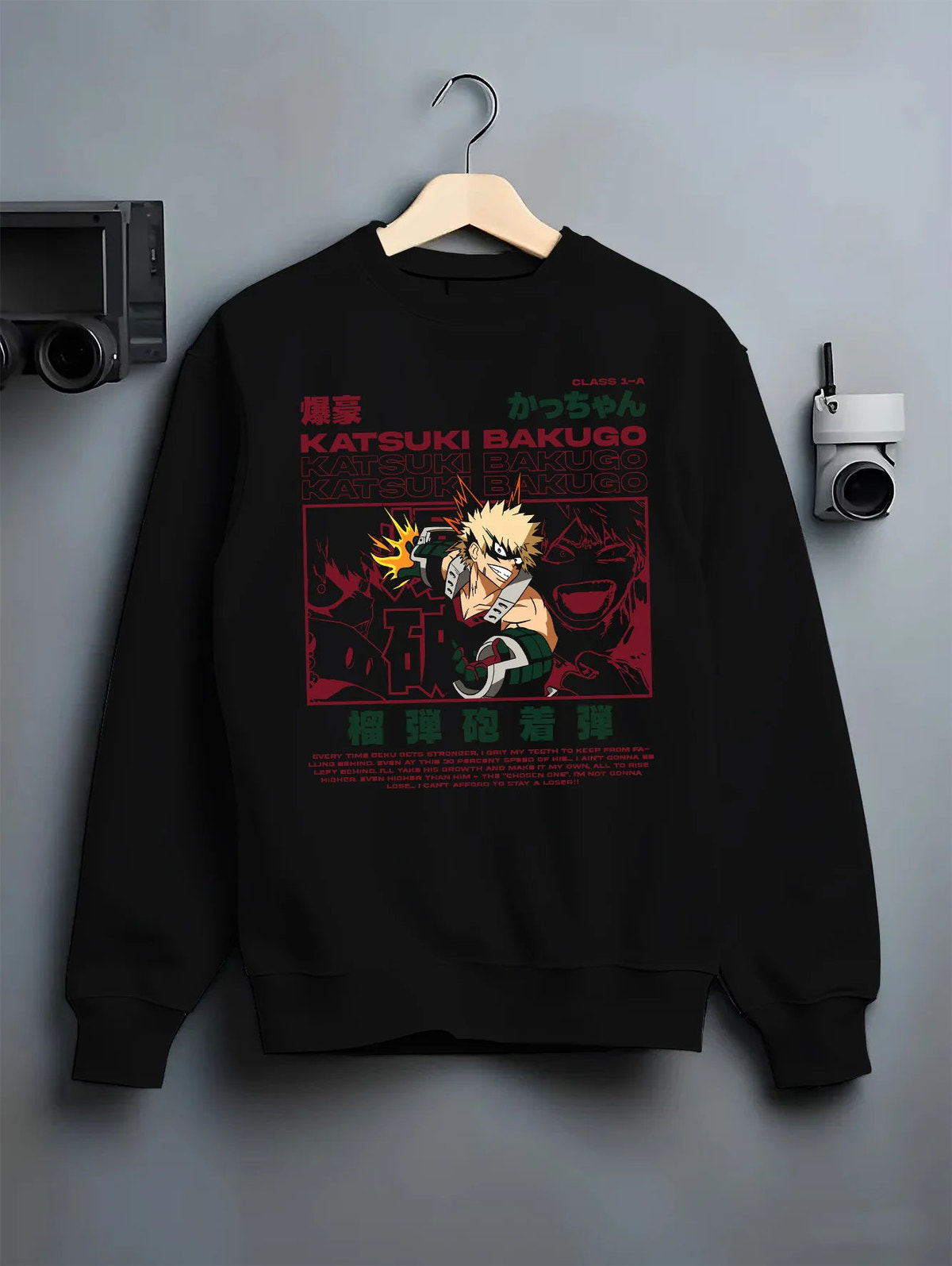 Black crewneck sweatshirt on hanger showing Katsuki Bakugo from My Hero Academia: comic collage