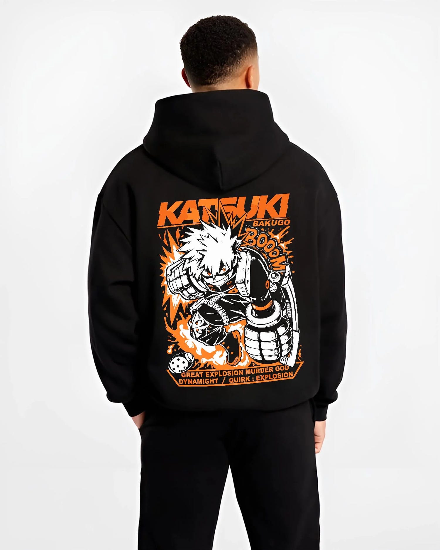 Black hoodie worn by male model, back view with Bakugo Dynamight Hoodie My Hero Academia Quirk Power graphic bold anime graphic.
