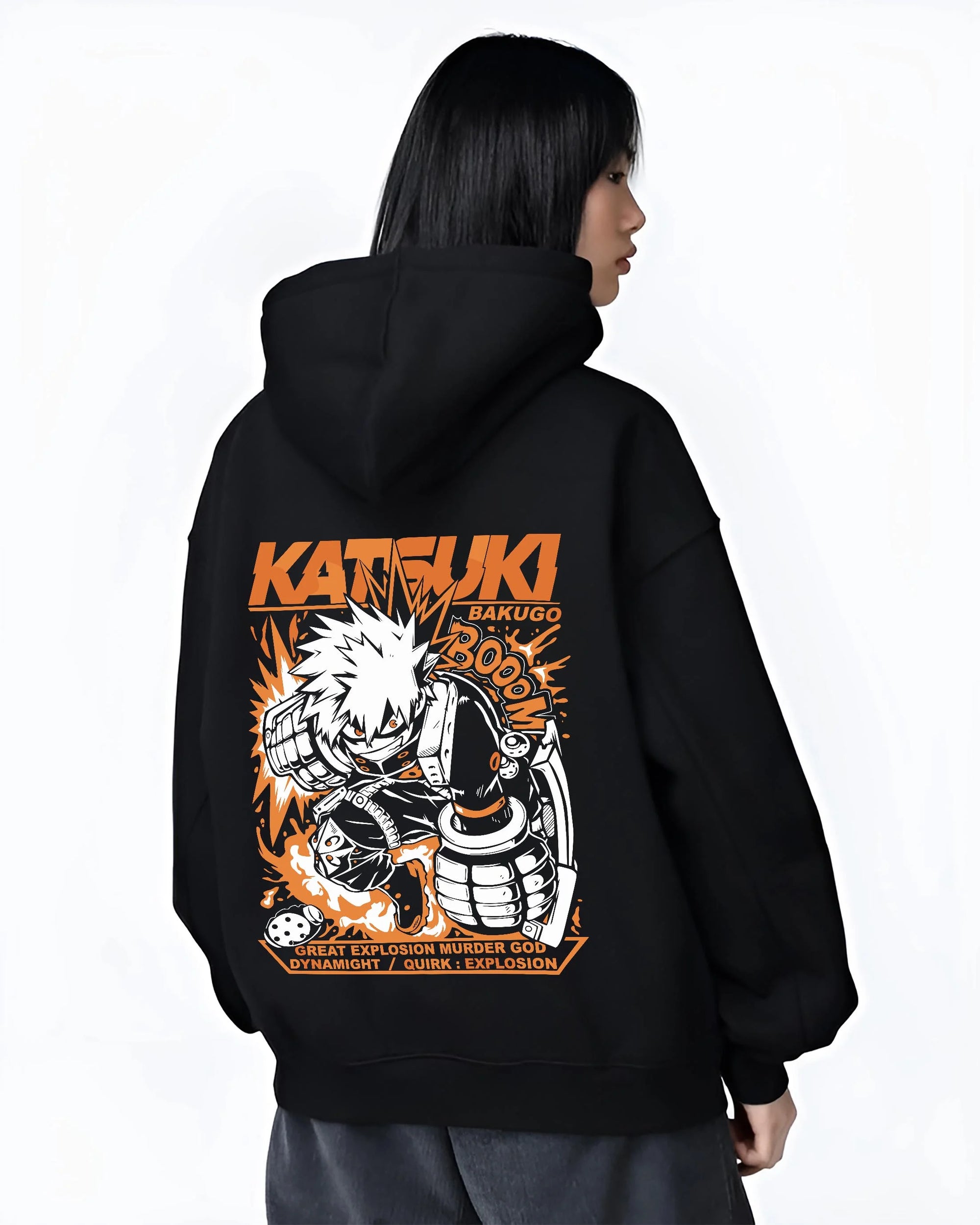 Black hoodie worn by female model, back view with Bakugo Dynamight Hoodie My Hero Academia Quirk Power graphic bold anime graphic.