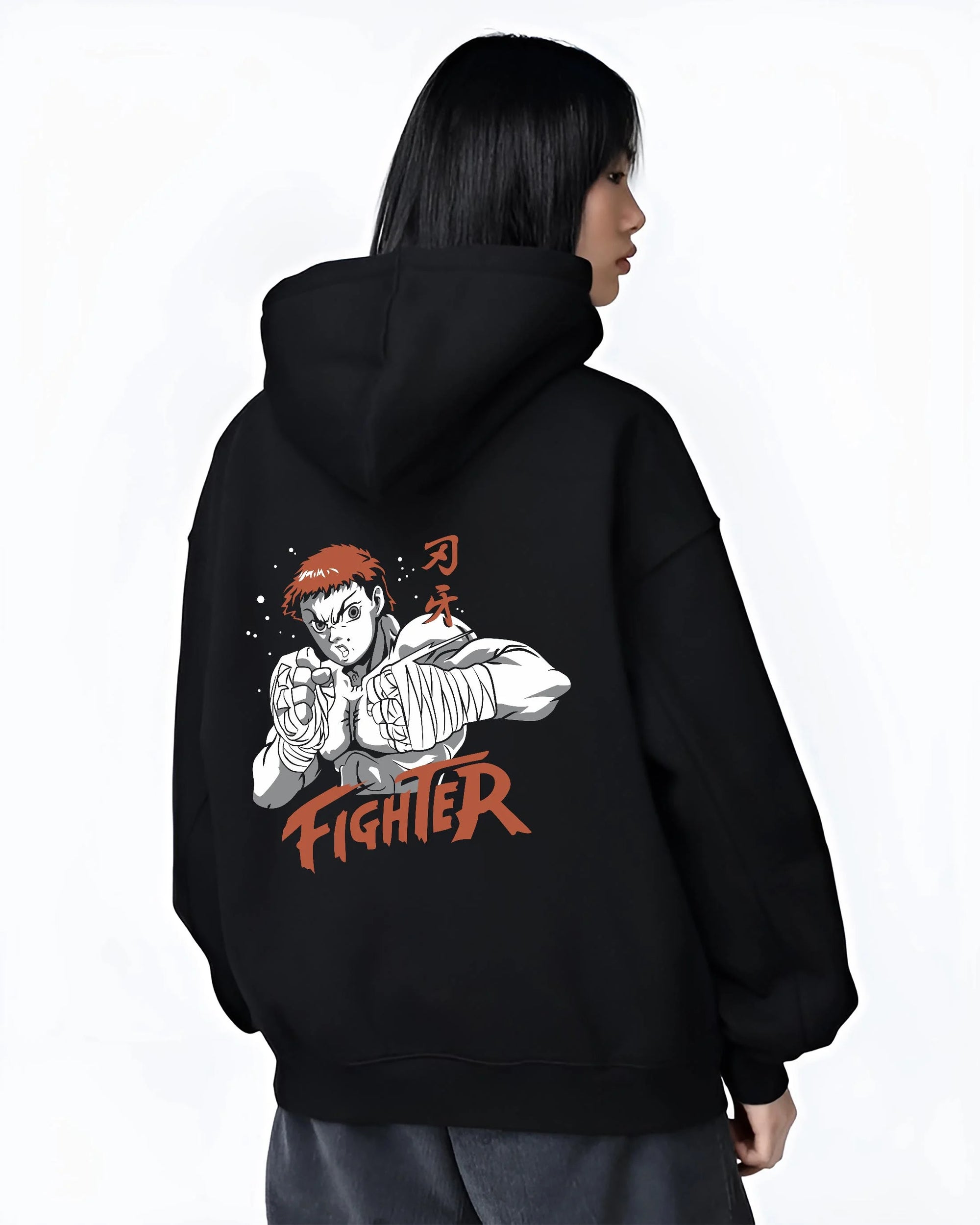Black hoodie worn by female model, back view with Baki Hanma Hoodie Grappler Baki Fighter Ring Stance graphic bold anime graphic.