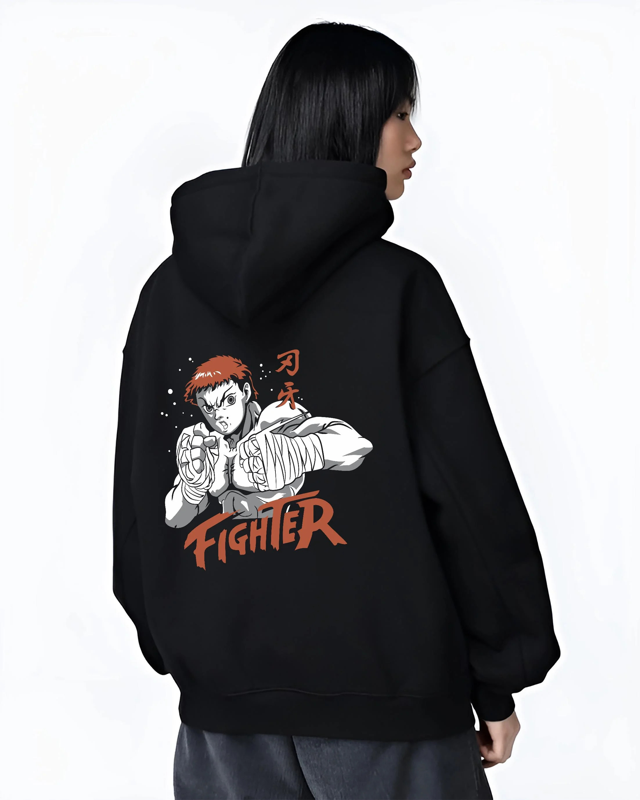 Black hoodie worn by female model, back view with Baki Hanma Hoodie Grappler Baki Fighter Ring Stance graphic bold anime graphic.