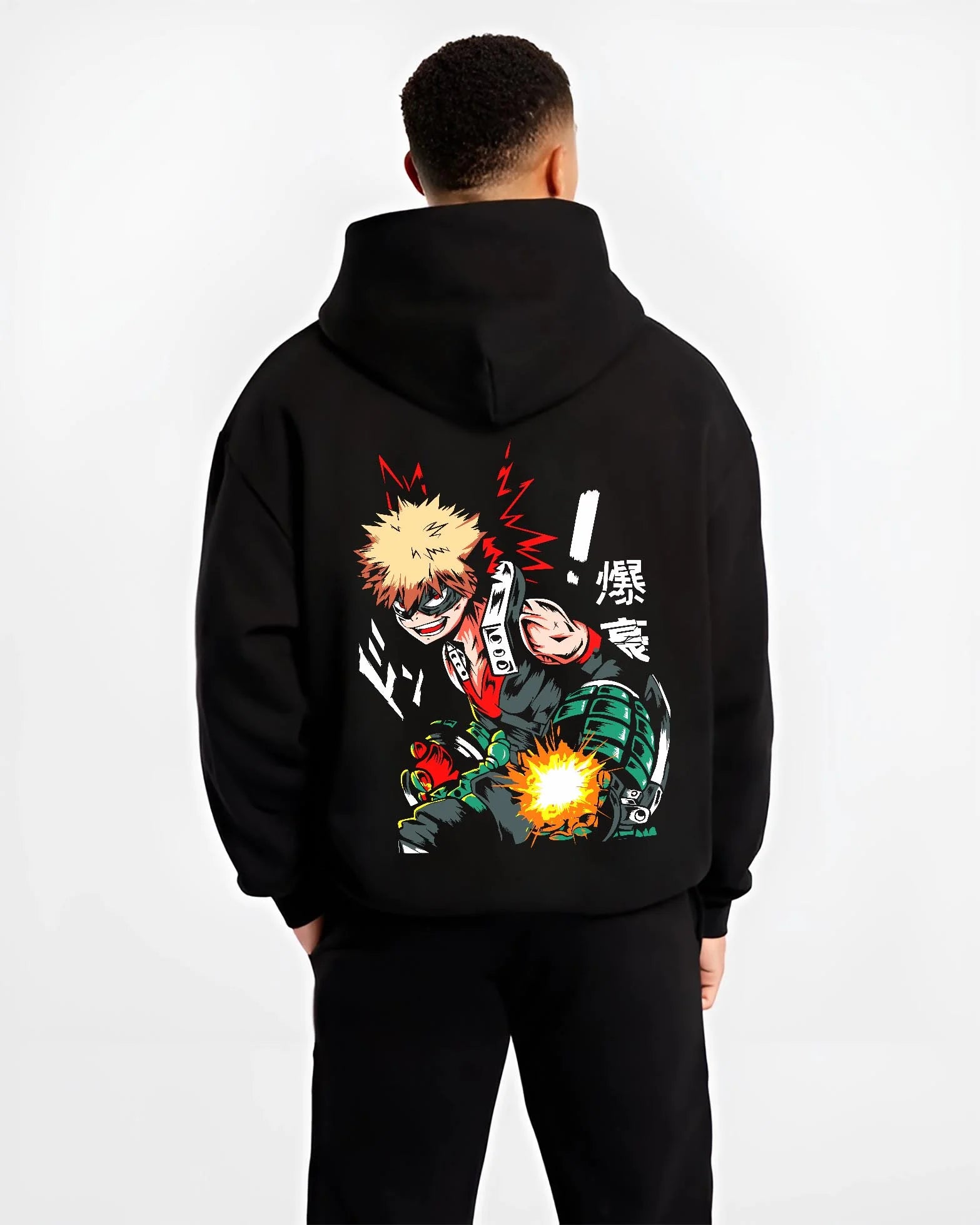 Black hoodie worn by male model, back view with Bakugo Hero Hoodie My Hero Academia Green Blast Scene graphic streetwear graphic.